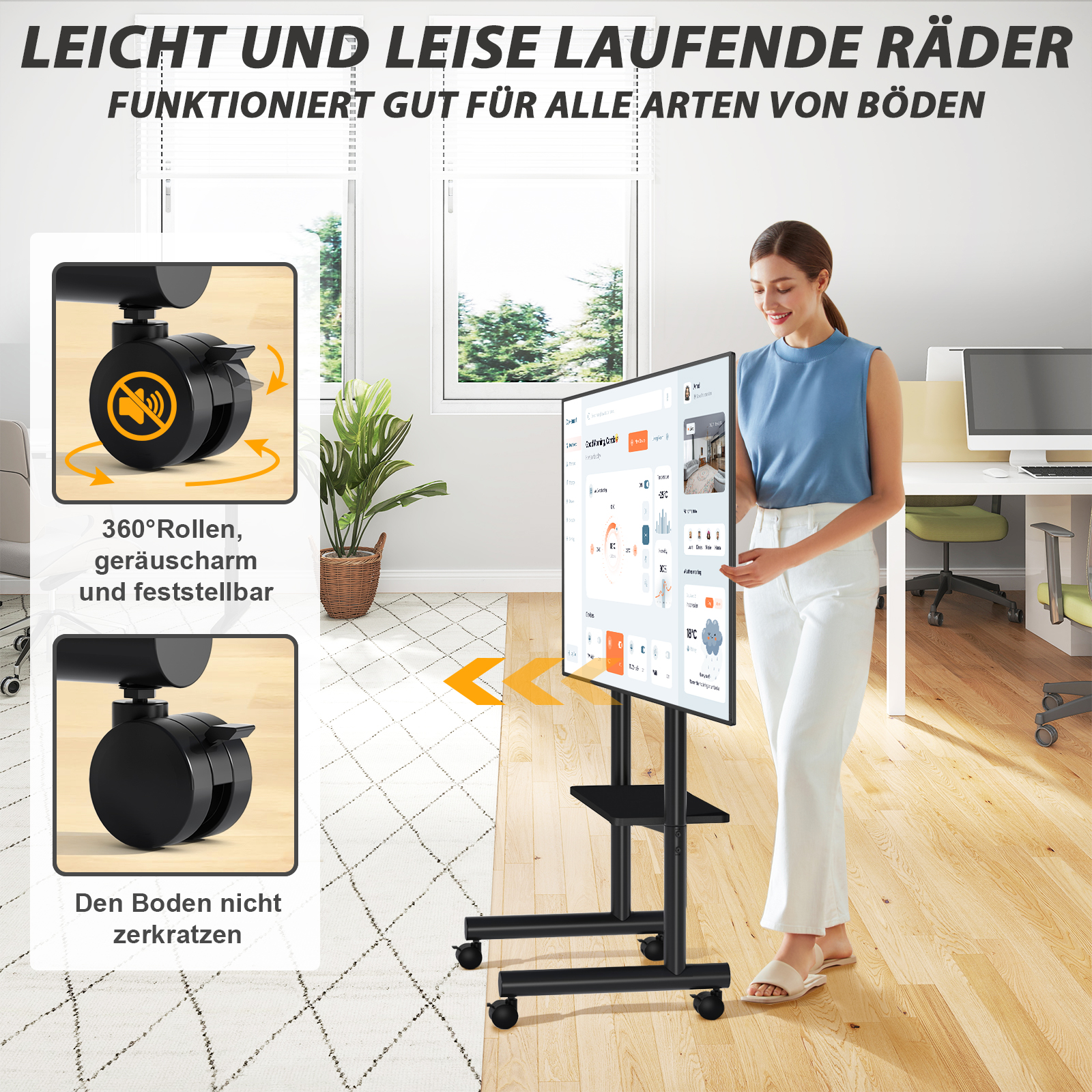 Ein Mann steht neben einem rollbaren TV-Ständer mit einem Bildschirm, der eine Benutzeroberfläche anzeigt.