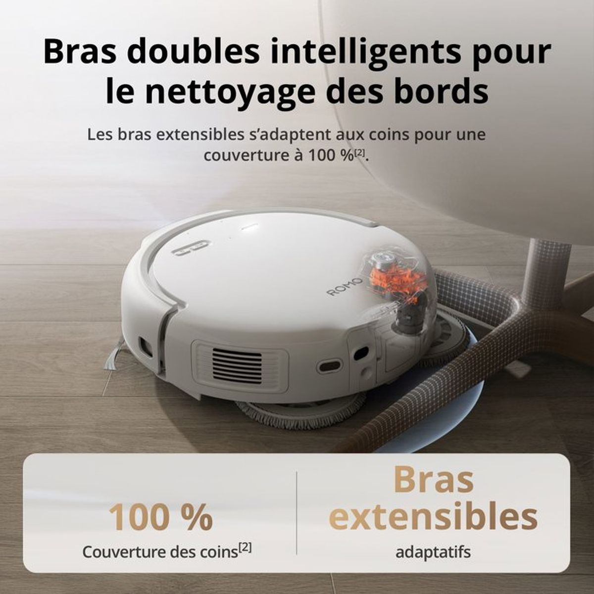 Un robot aspirador blanco con brazos extensibles limpia esquinas en suelo de madera.