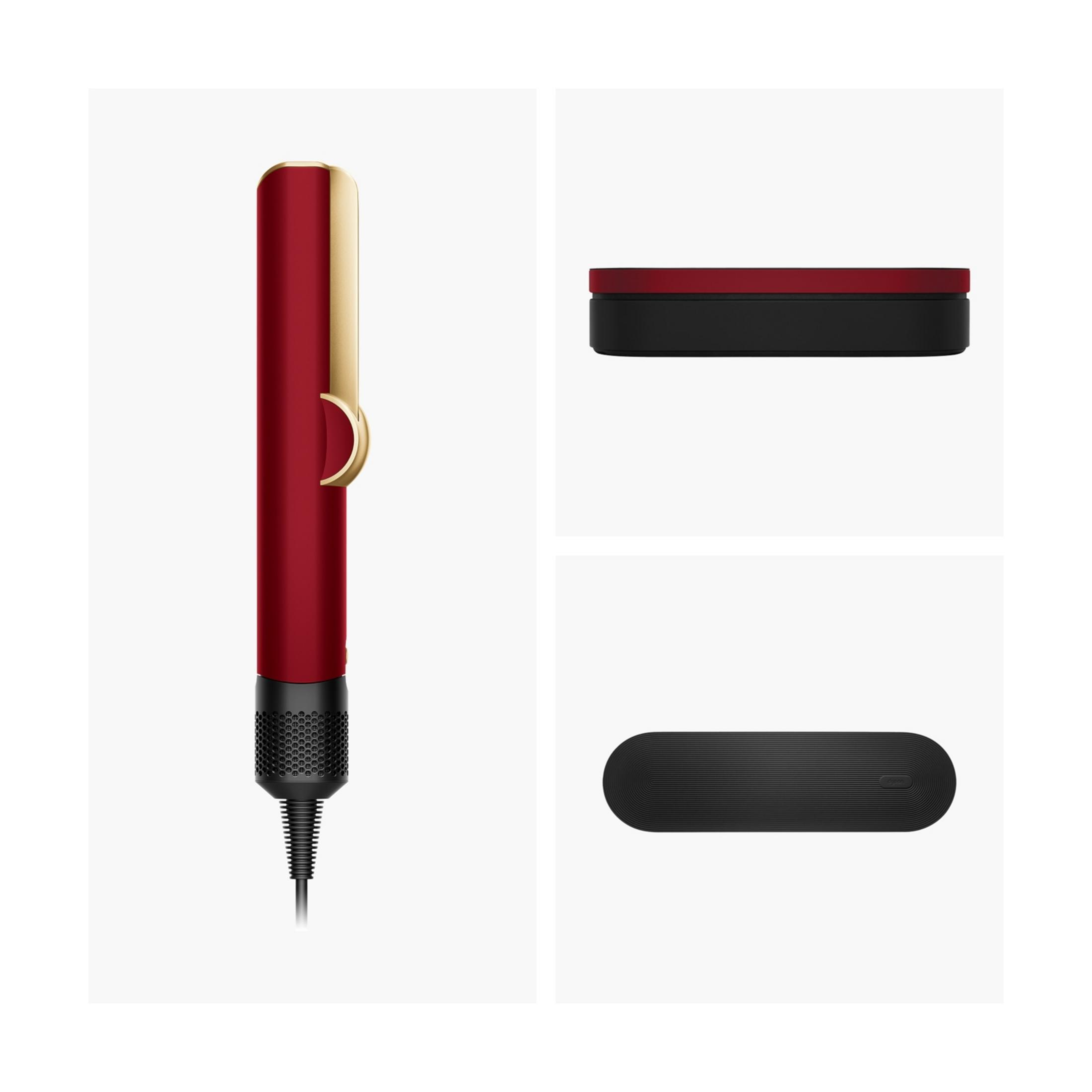 Una piastra per capelli rossa con accento dorato e manico nero.