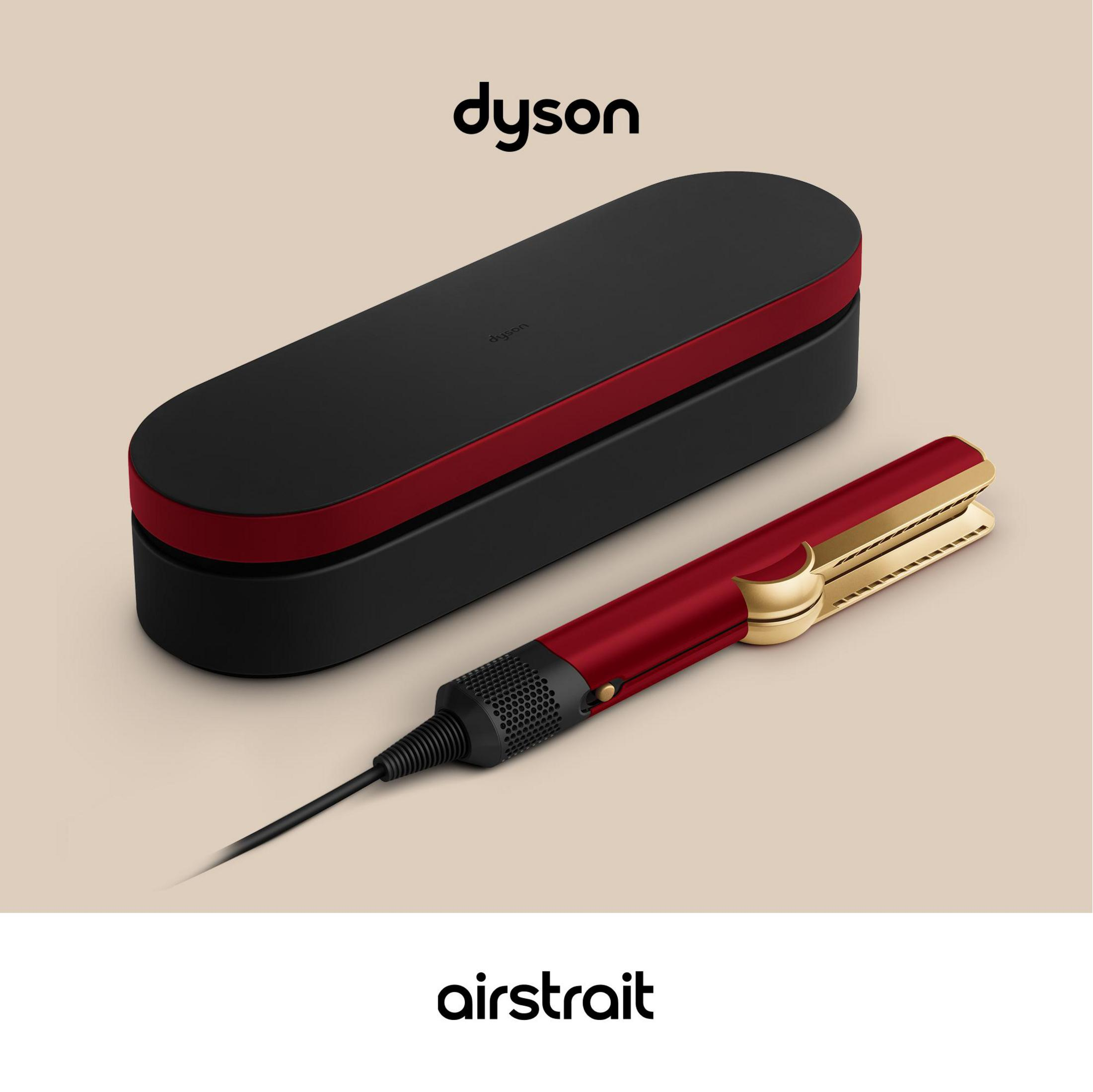 Un Dyson Airstrait rosso con custodia nera e accento rosso.