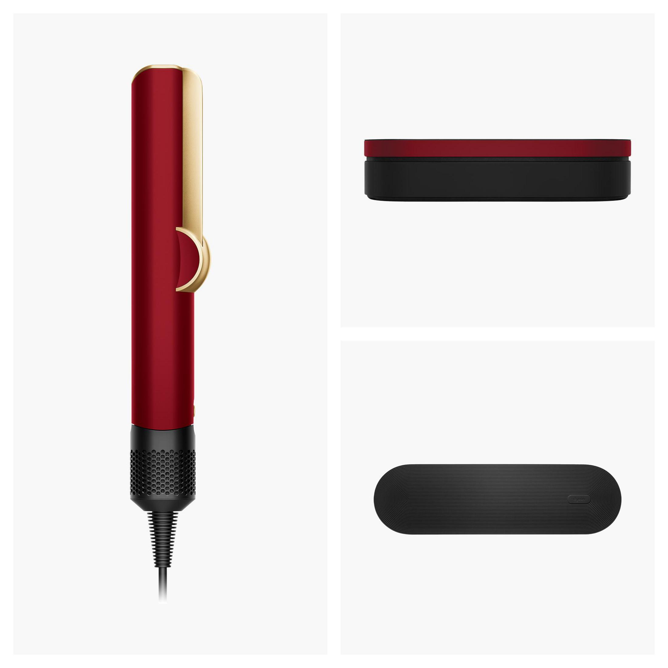 Una piastra per capelli rossa con accenti dorati e manico nero.