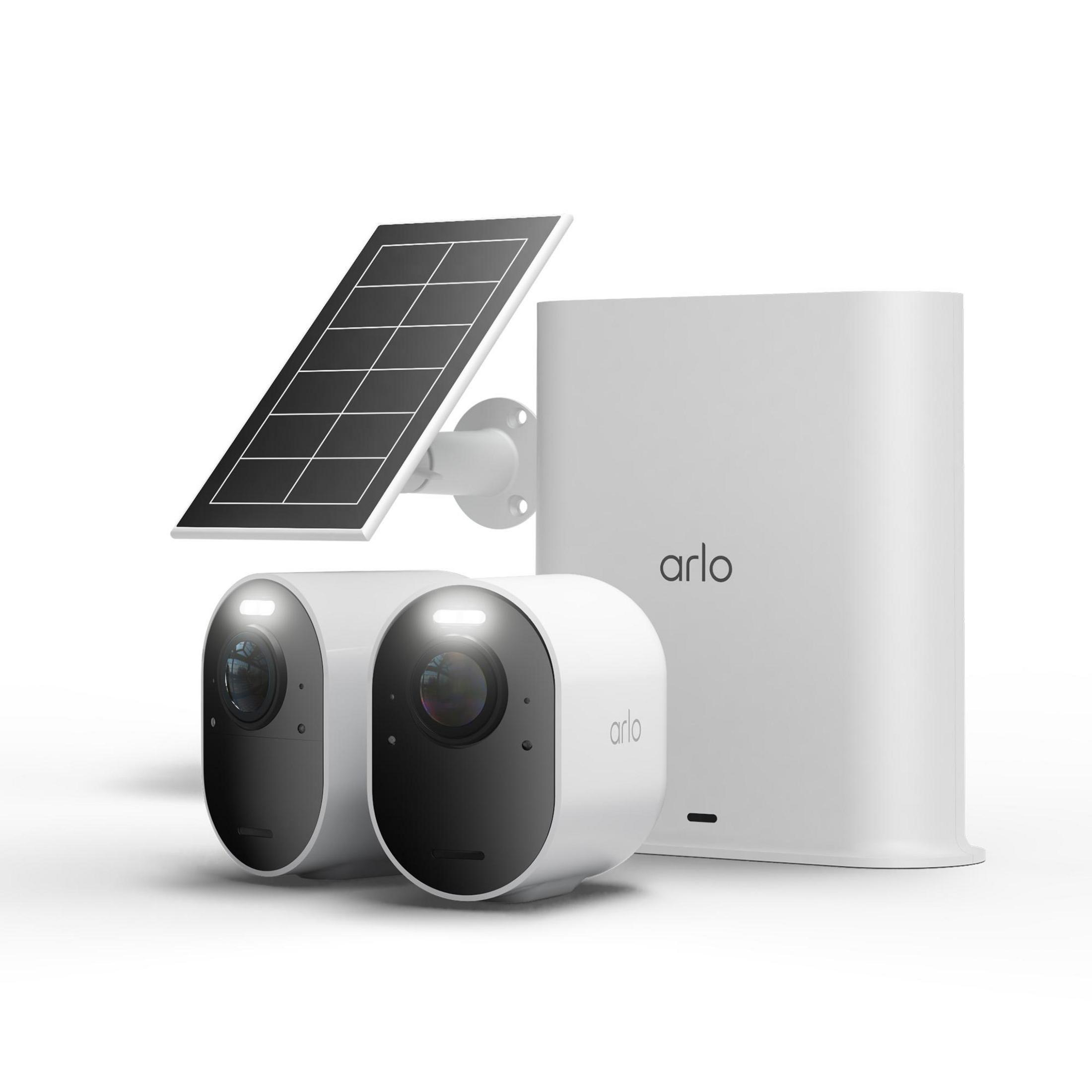 Zwei weiße Arlo-Kameras mit Solarpanel und Basisstation.