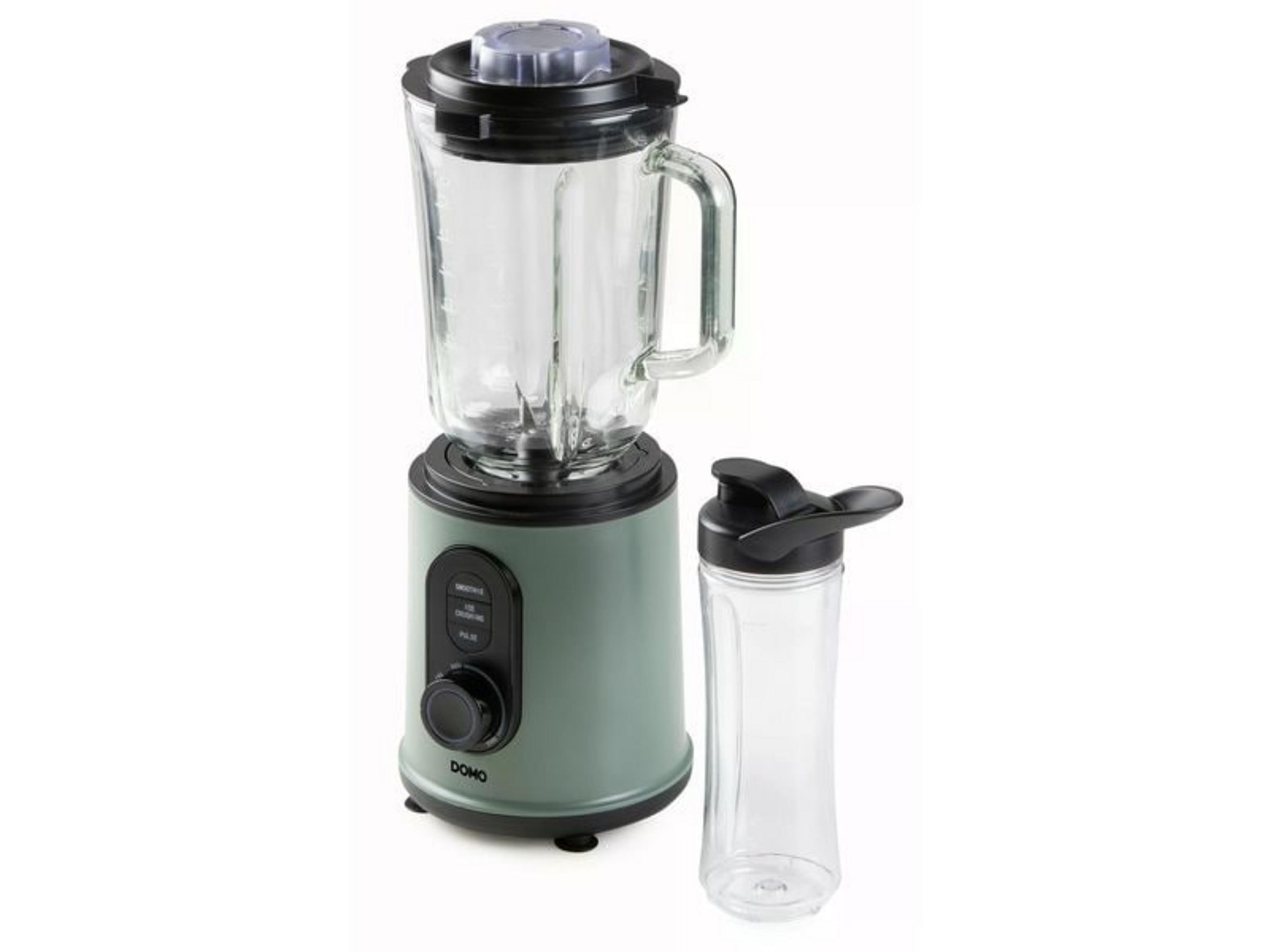 Un mixeur vert avec un bocal en verre et une tasse de voyage vide à côté.