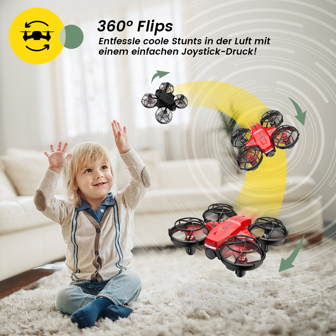 Ein Junge spielt mit einem roten und schwarzen Drone im Wohnzimmer.