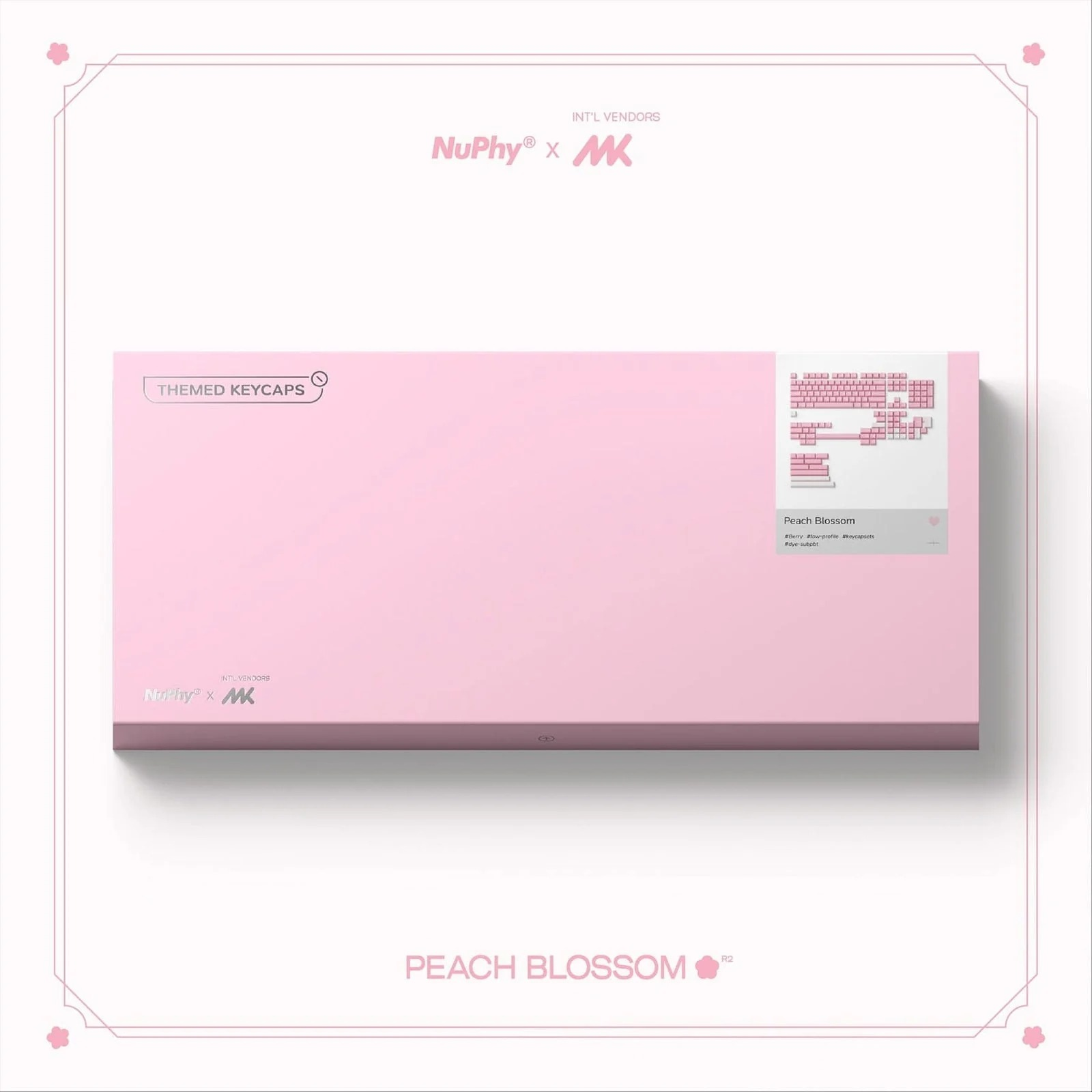 Różowe pudełko z klawiszami "Peach Blossom" i logo.