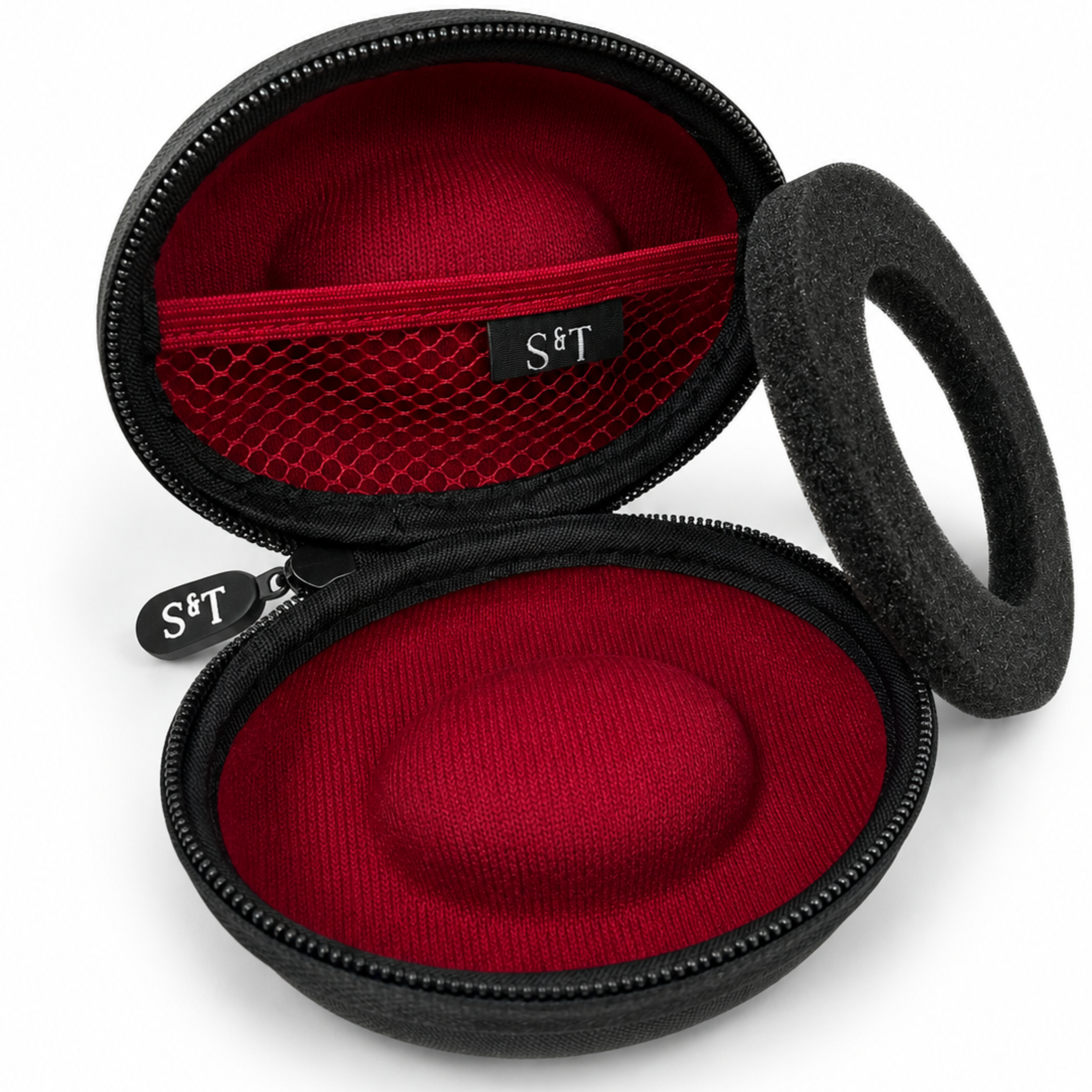Schwarze runde Tasche mit rotem Innenfutter und Schaumstoffring.
