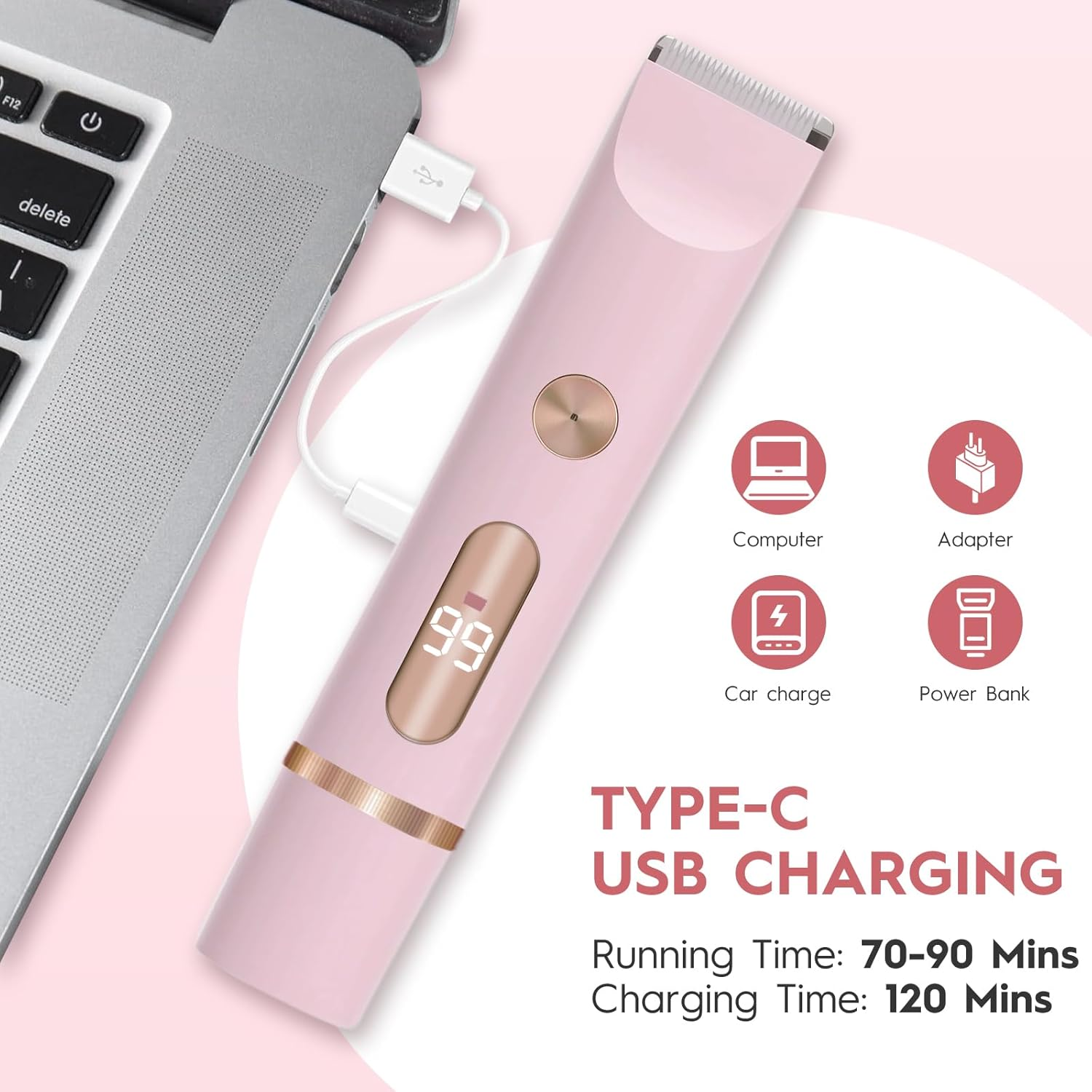 Ein pinker Haarschneider wird über USB von einem Laptop geladen.
