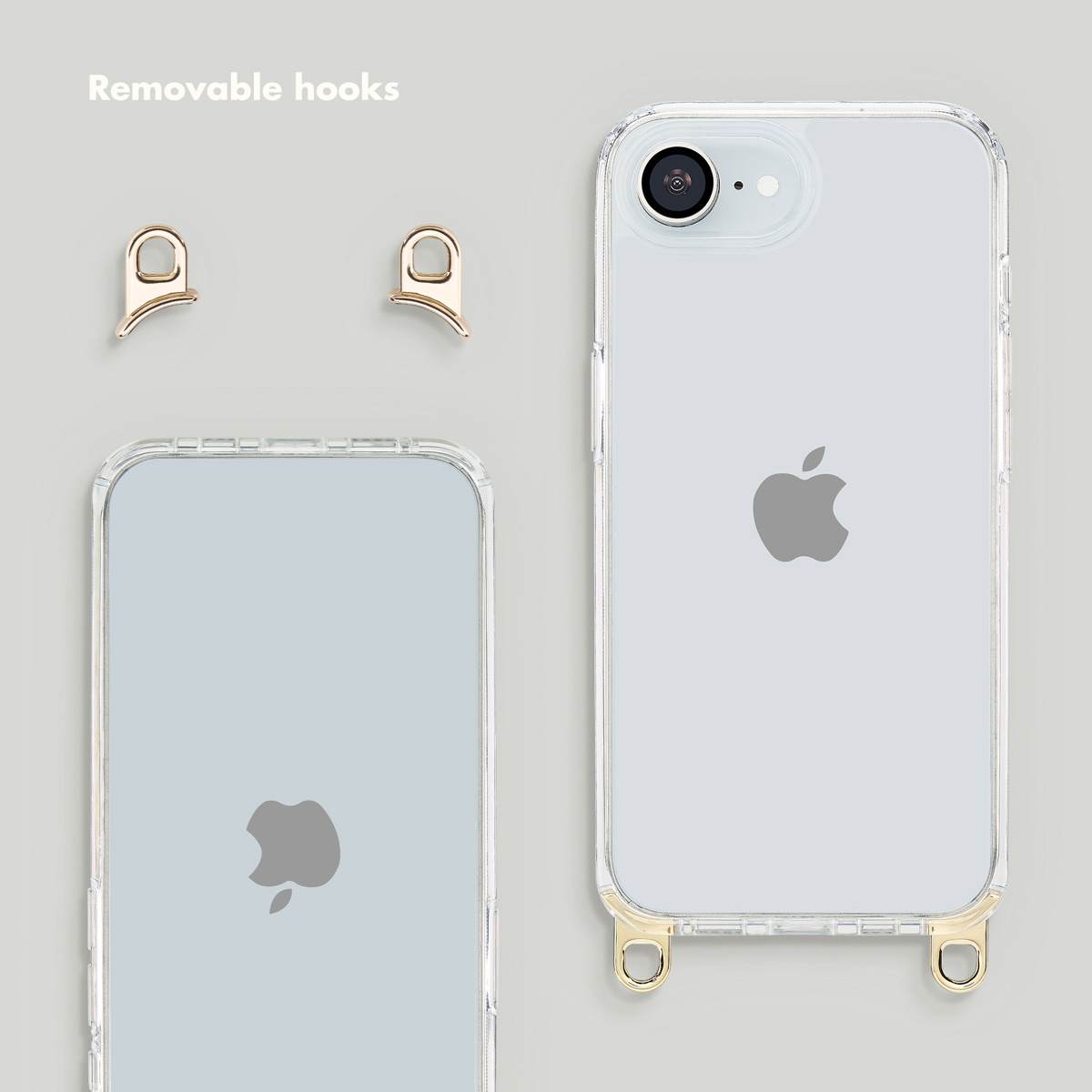 Deux coques transparentes et deux crochets dorés amovibles sur fond gris.