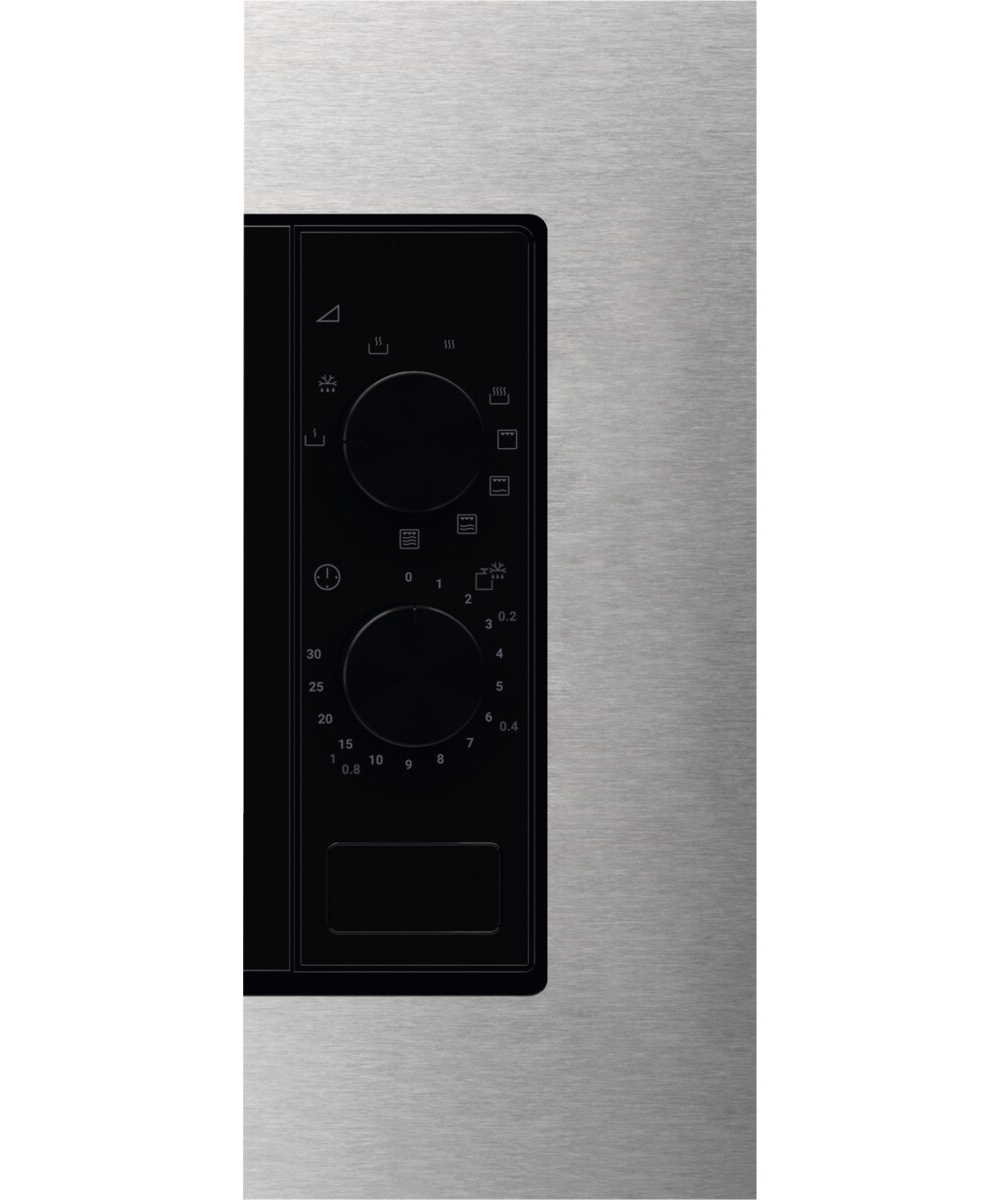 Panel de control de microondas de acero inoxidable con dos diales y símbolos.