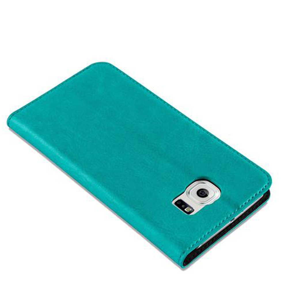 Una custodia per telefono color verde acqua con la fotocamera visibile sul retro.