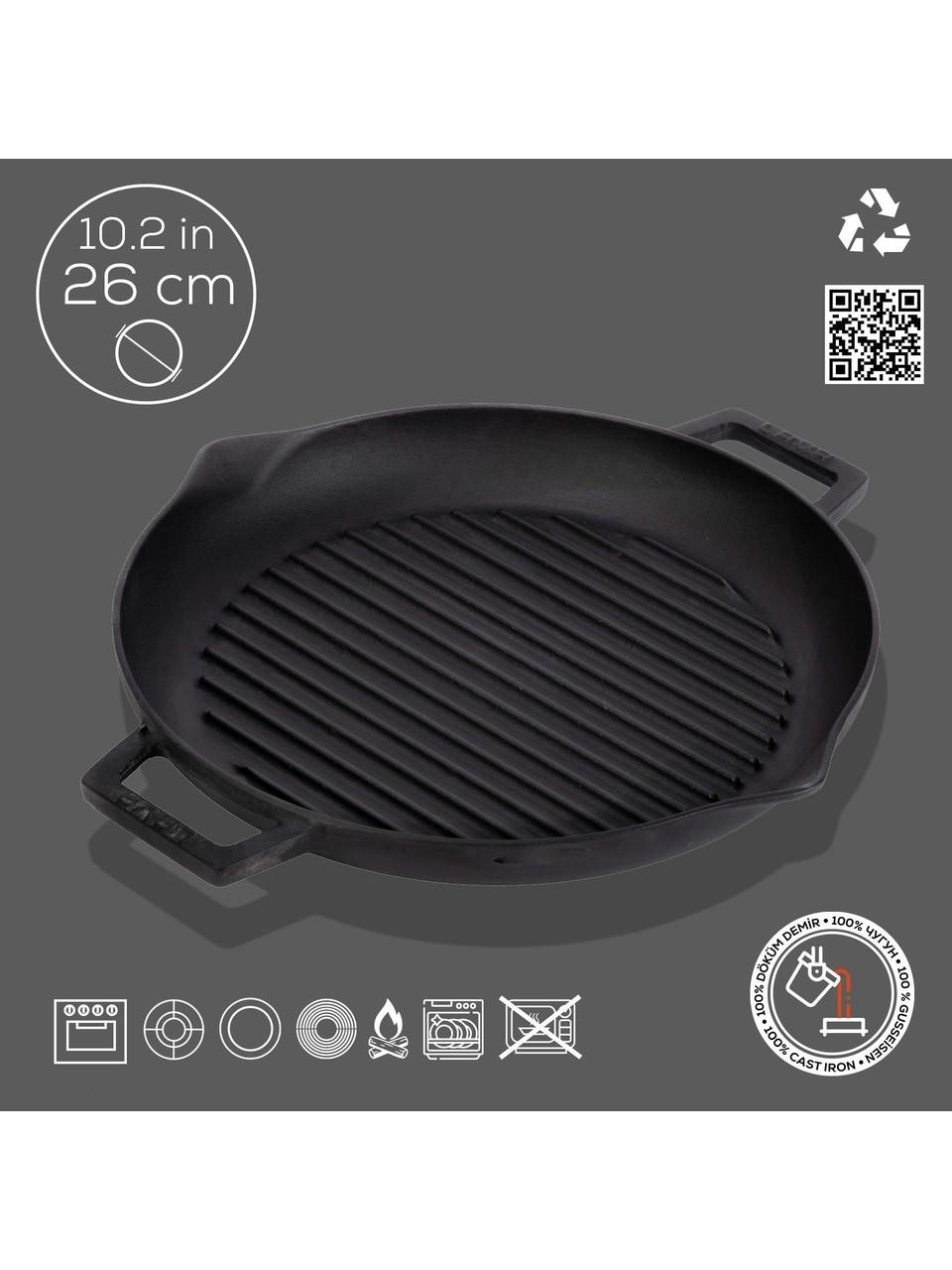 Gri arka plan üzerinde siyah ızgara tava, 26 cm çapında.