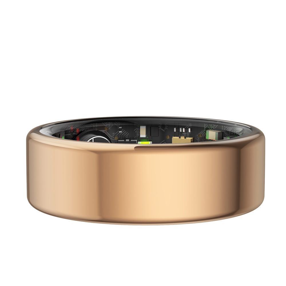 Ein roségoldener Ring mit transparenter Innenfläche, die elektronische Bauteile zeigt.