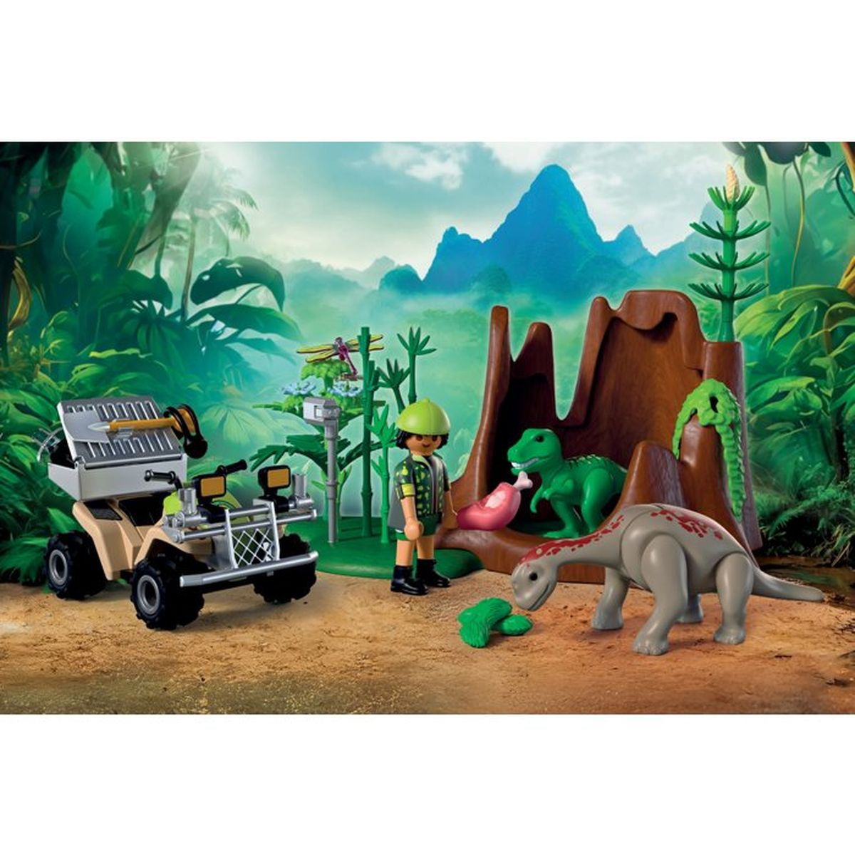 Un niño con uniforme está junto a un set de dinosaurios con vehículo y volcán.
