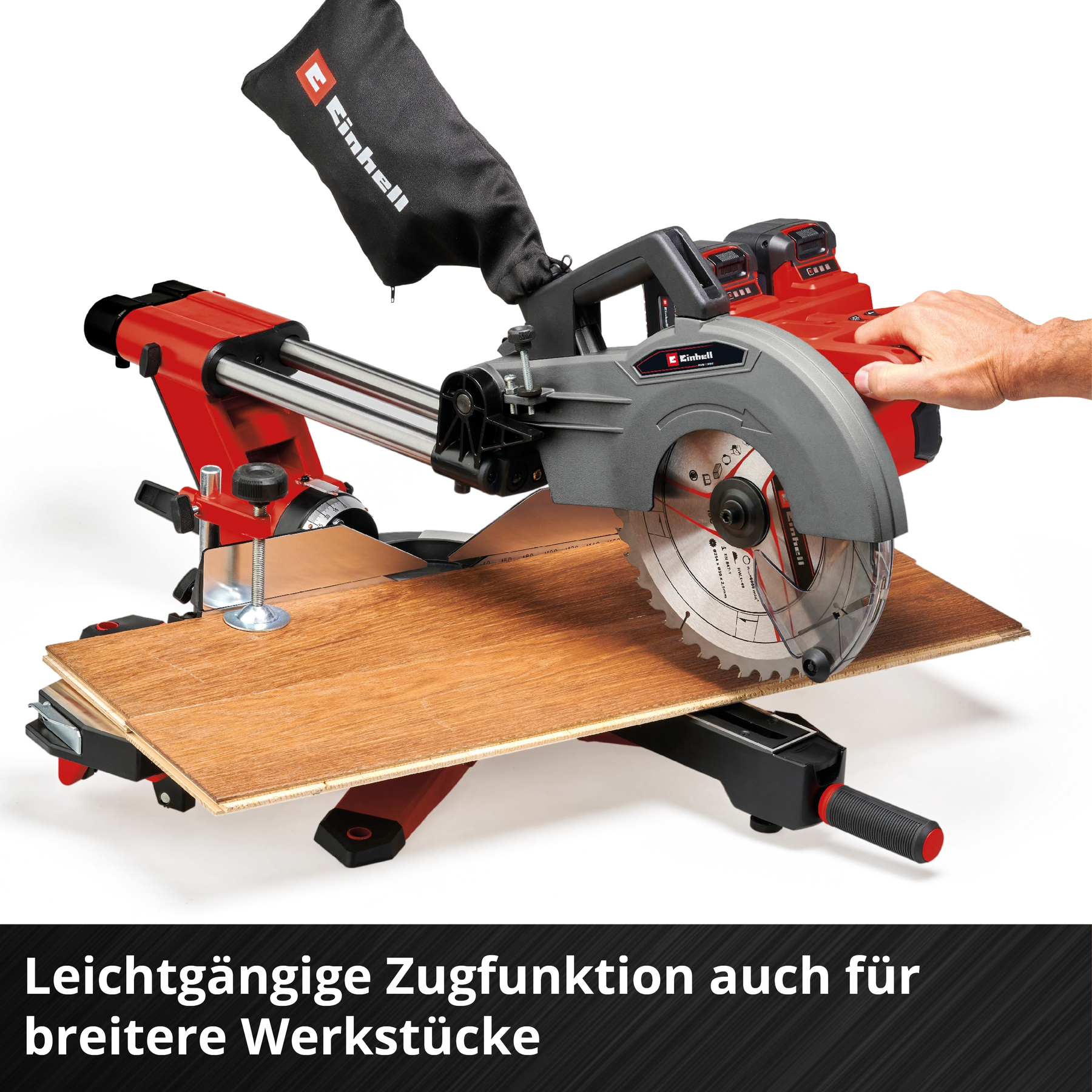 Eine rote und graue Kappsäge mit Sägeblatt auf einem Holzboden.