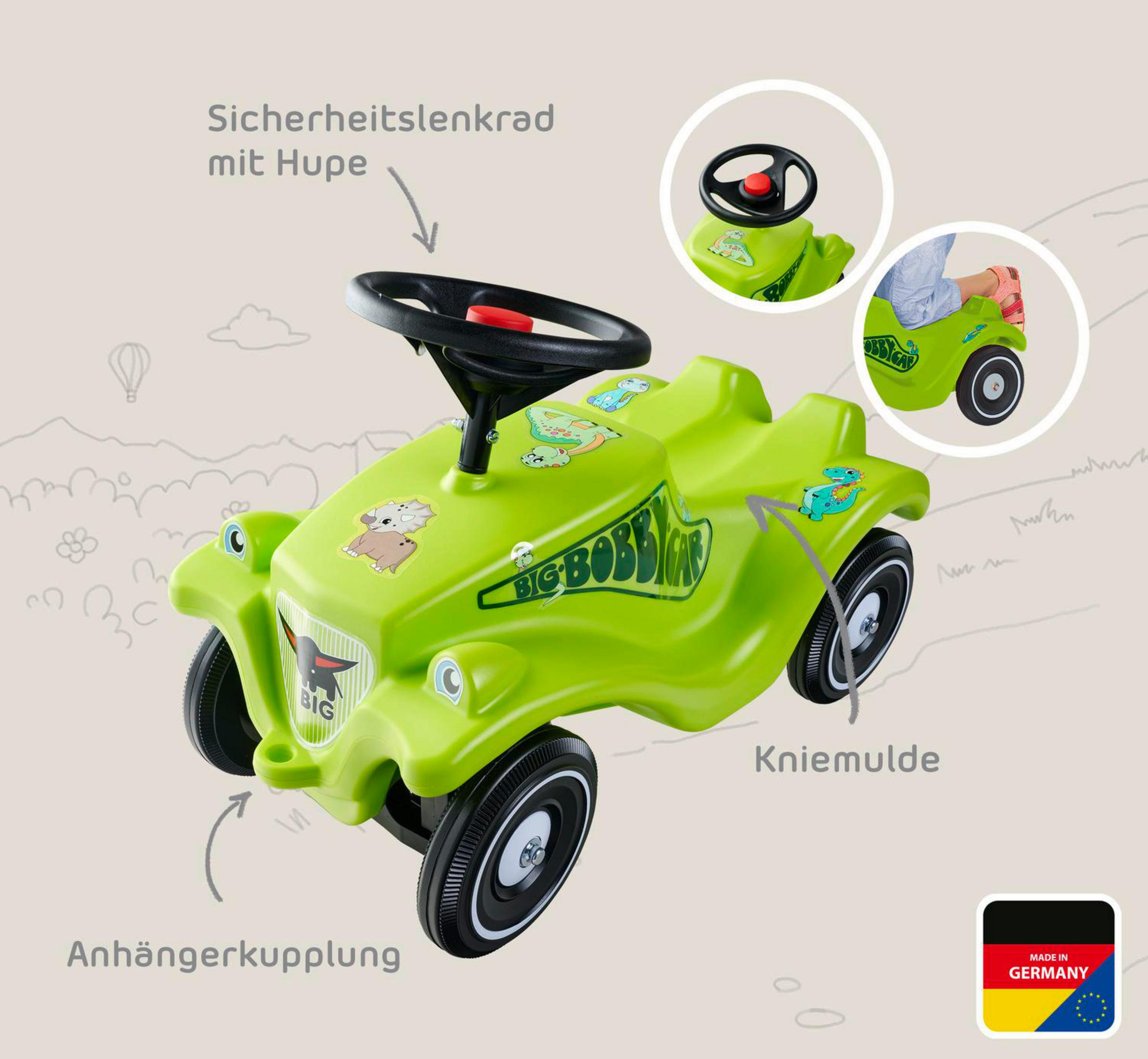 Ein leuchtend grünes Kinderfahrzeug mit Aufklebern von Dinosauriern und einem Elefanten.