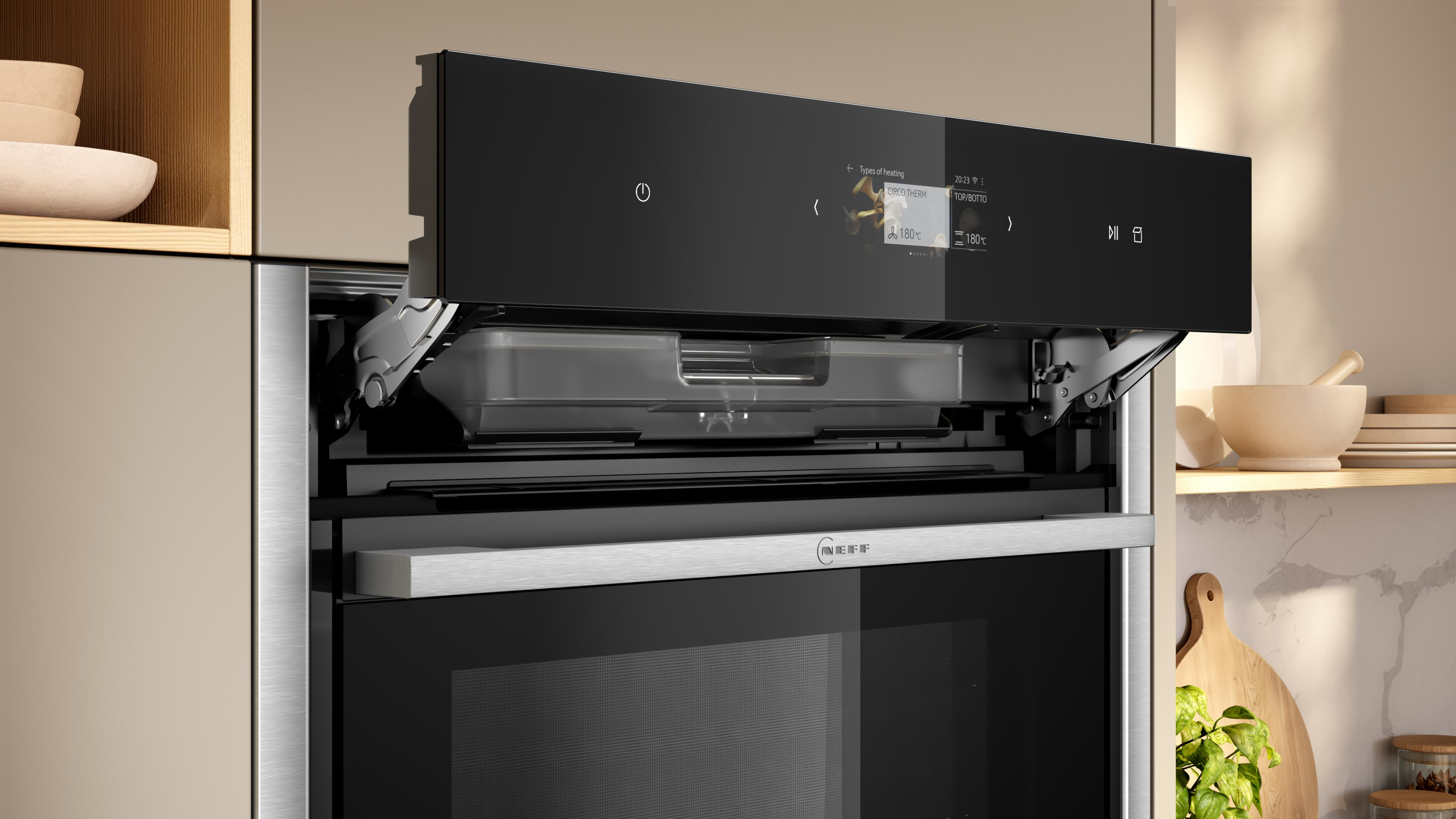 Ein moderner Ofen mit offenem Fach und Touchscreen-Display, das Heizarten anzeigt.