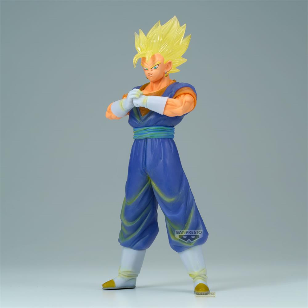 Eine Figur von Vegito mit gelben Haaren, blauer Kleidung und weißen Handschuhen.