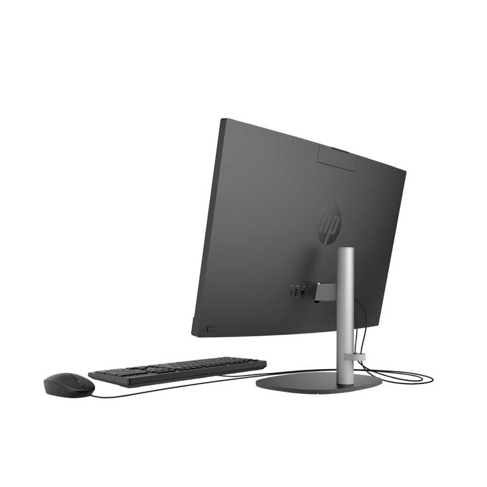 Widok z tyłu czarnego komputera HP All-in-One z klawiaturą i myszką.