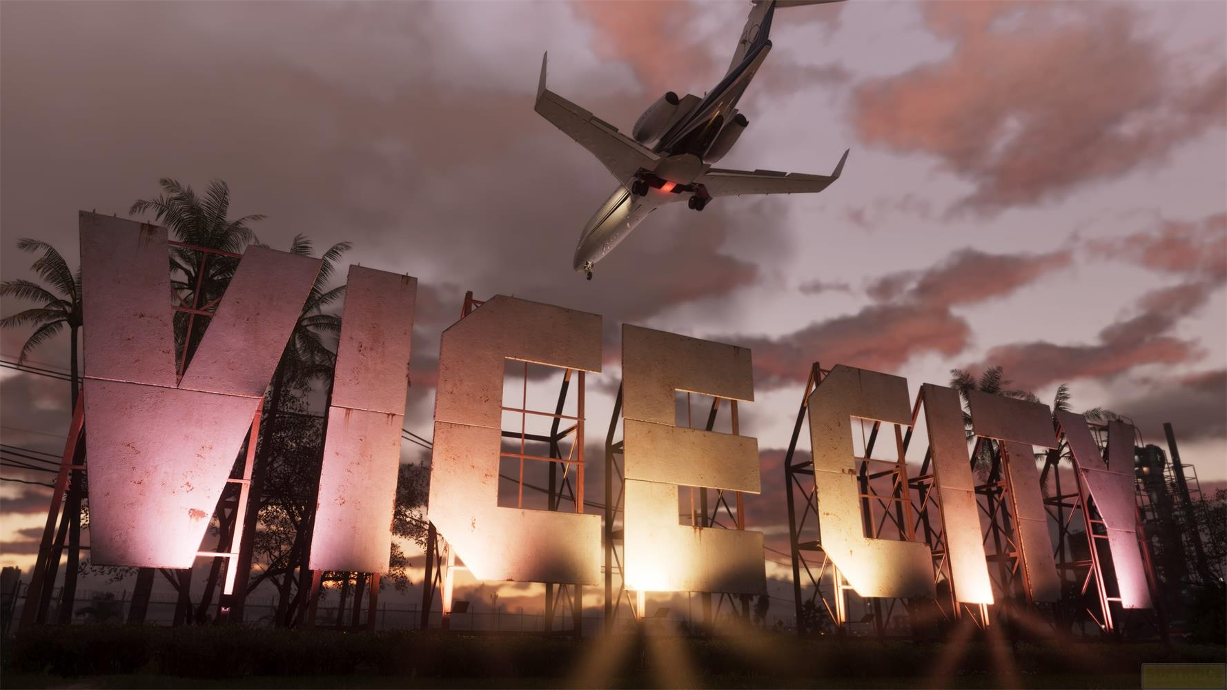 Un aereo sorvola un grande cartello "VICE CITY" al tramonto.