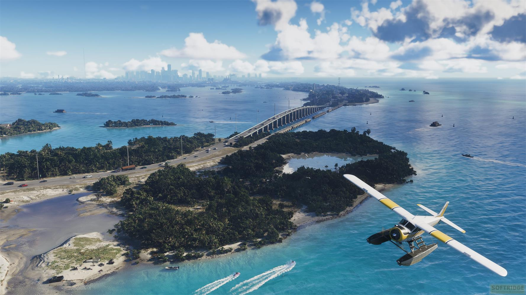 Un idrovolante vola sull'acqua turchese accanto a un'isola con un ponte e uno skyline.