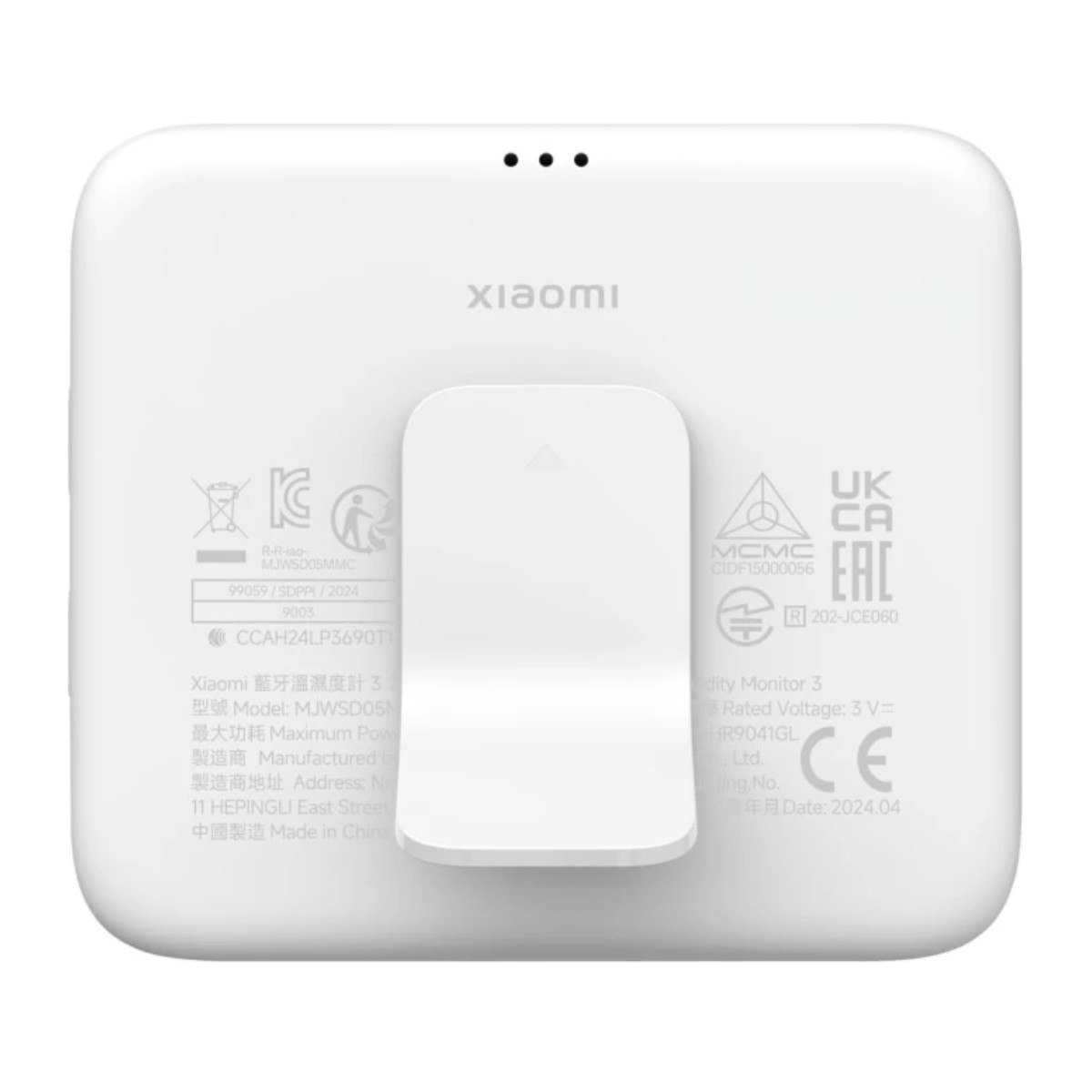 Reverso blanco de un termohigrómetro Xiaomi con sellos y número de modelo.