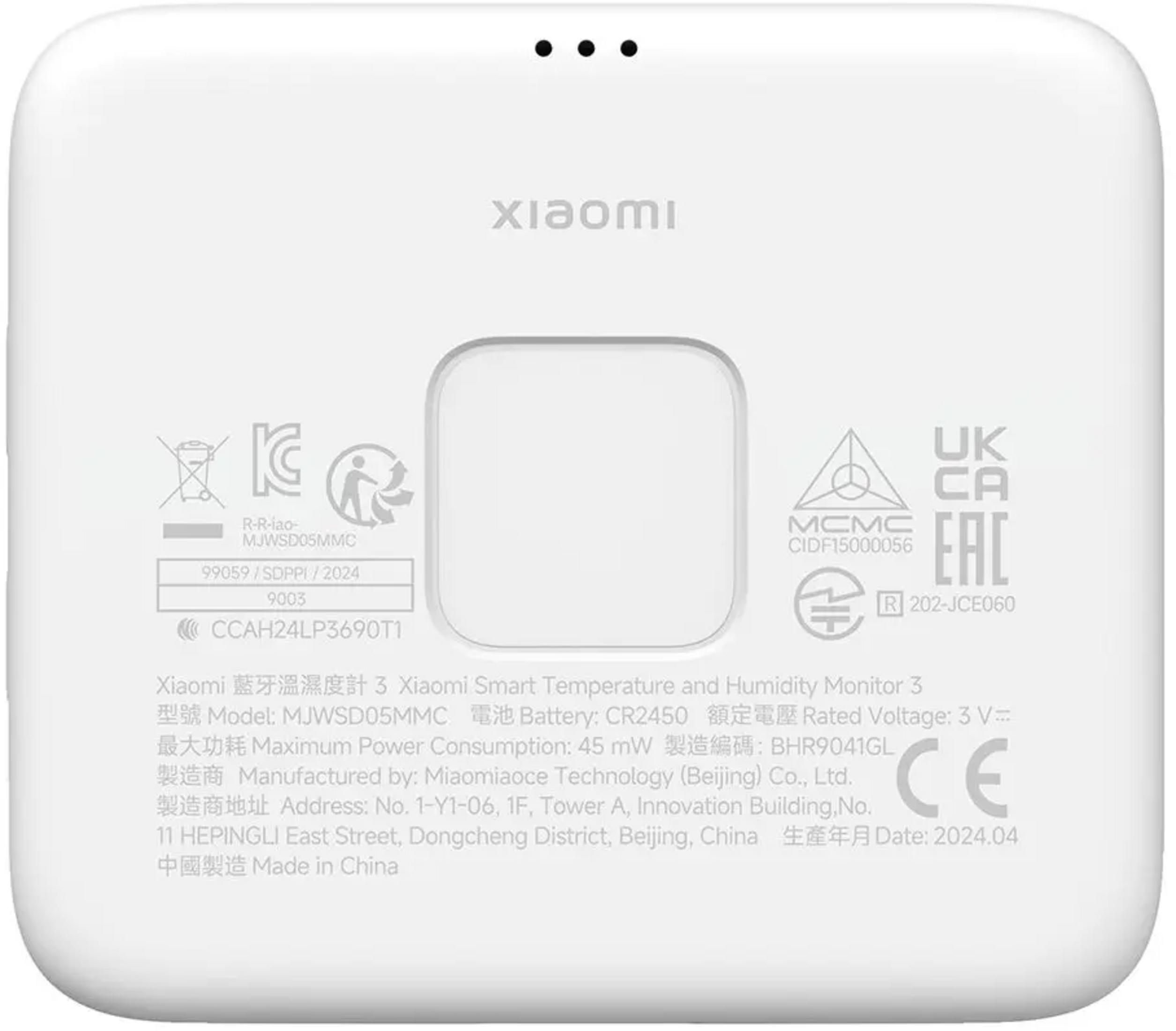 Parte posterior de un monitor Xiaomi de temperatura y humedad blanco con certificaciones.