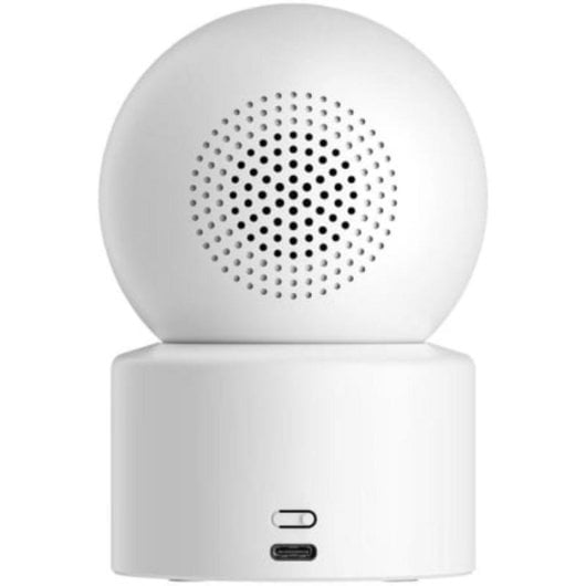 Una cámara esférica blanca con rejilla de altavoz y puertos USB.