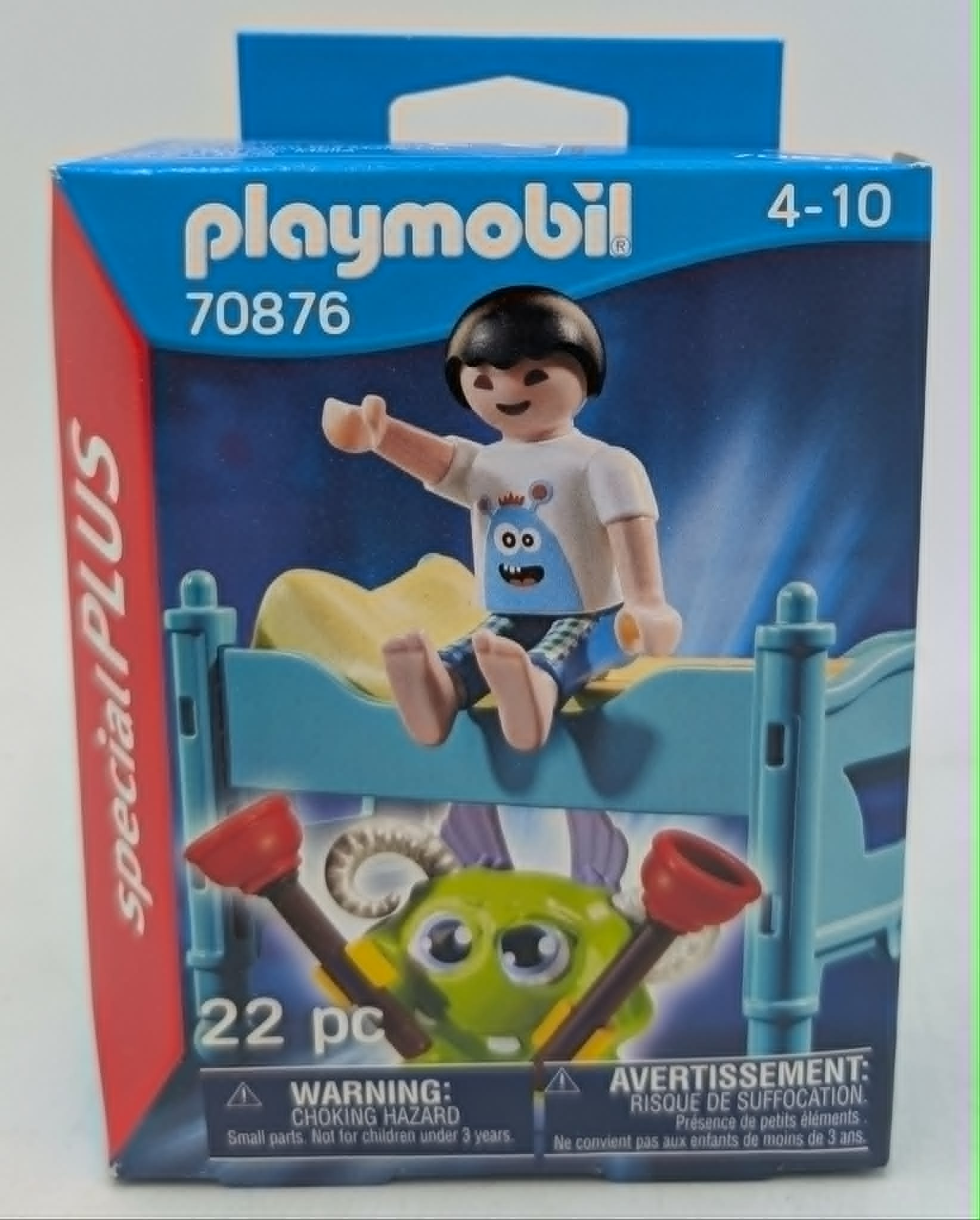 Caja Playmobil con niño en cama y figura de monstruo.