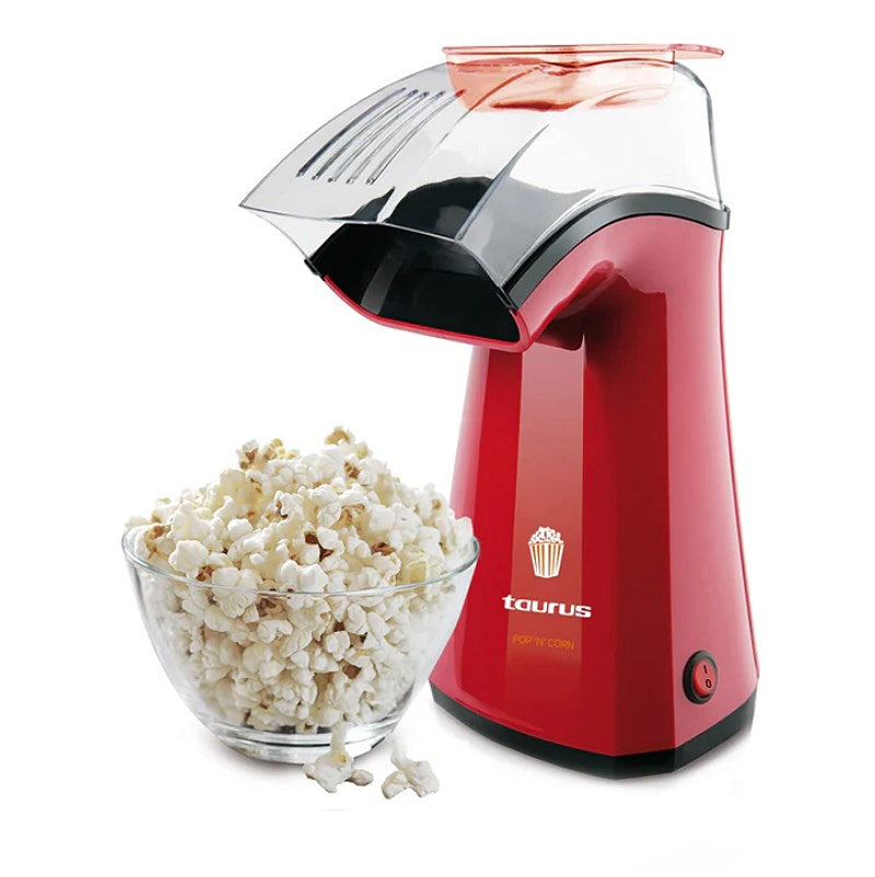 Roter Popcornautomat neben einer Schüssel mit Popcorn.