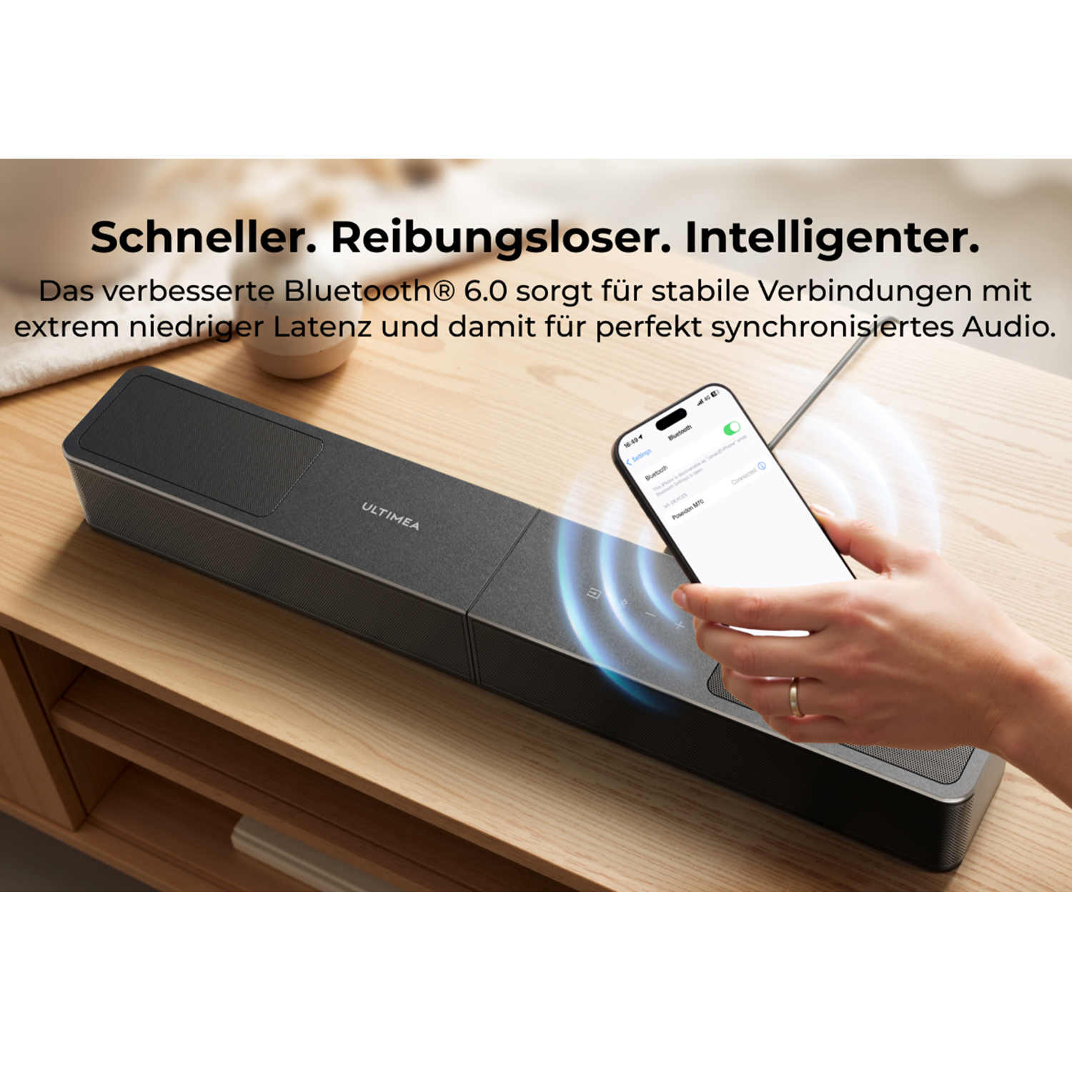 Ein Smartphone verbindet sich mit einer schwarzen Ultimea Soundbar über Bluetooth 6.0.