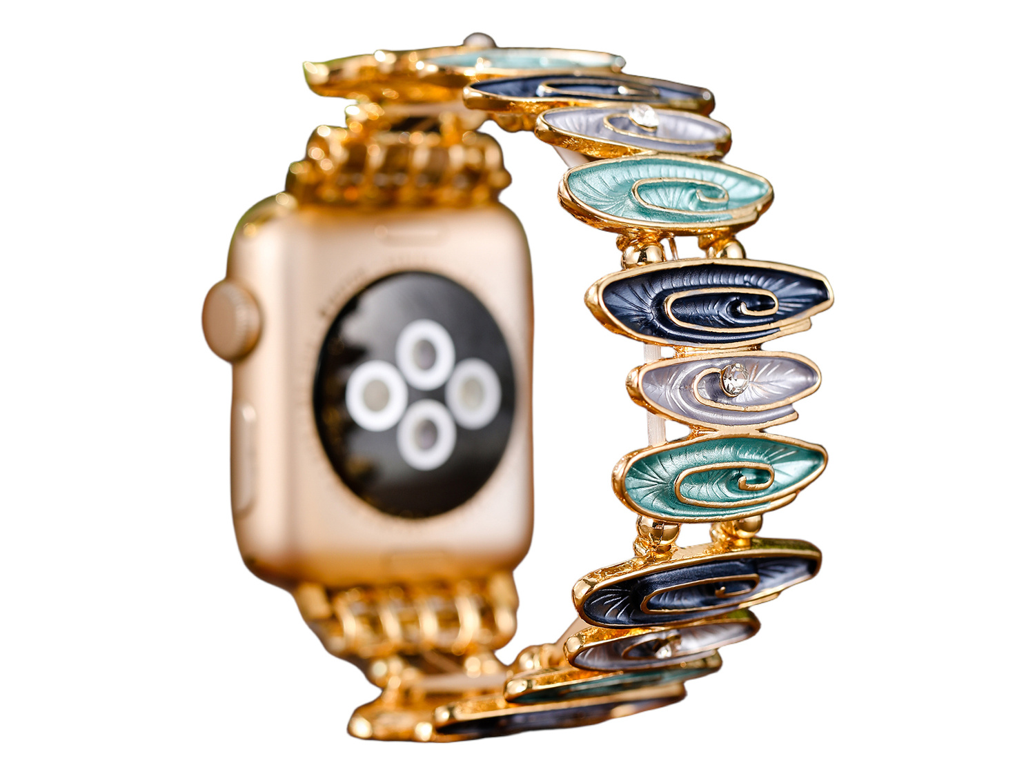 Złoty smartwatch z ozdobną niebiesko-zielono-szarą bransoletą.