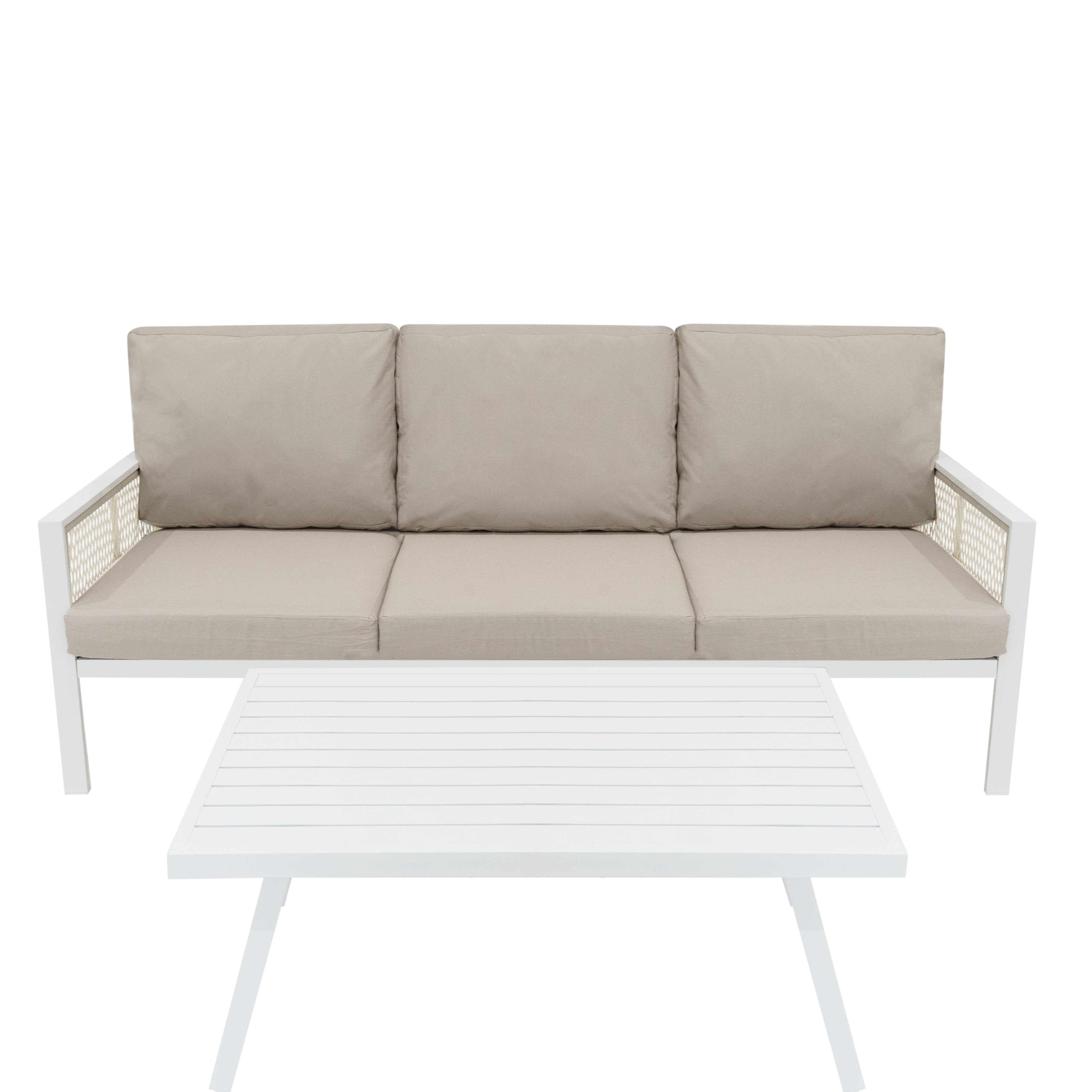Un sofá blanco con cojines beige claro y una mesa de centro blanca.