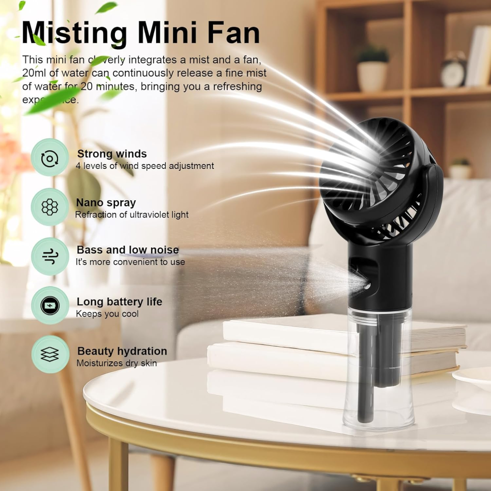 Schwarzer Mini-Ventilator mit Sprühfunktion auf einem Tisch.