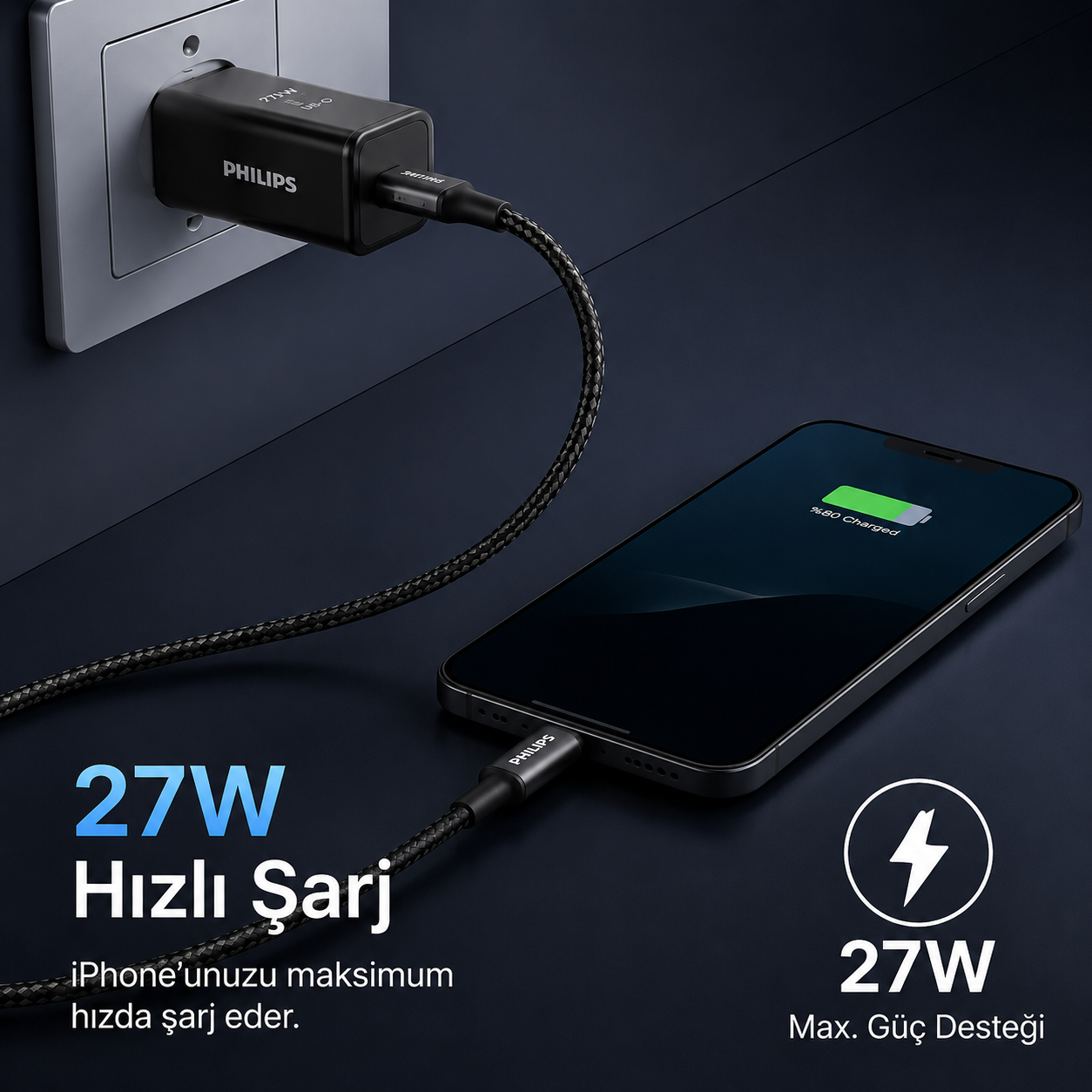 Siyah bir Philips şarj cihazı prize takılı, iPhone şarj ediyor.