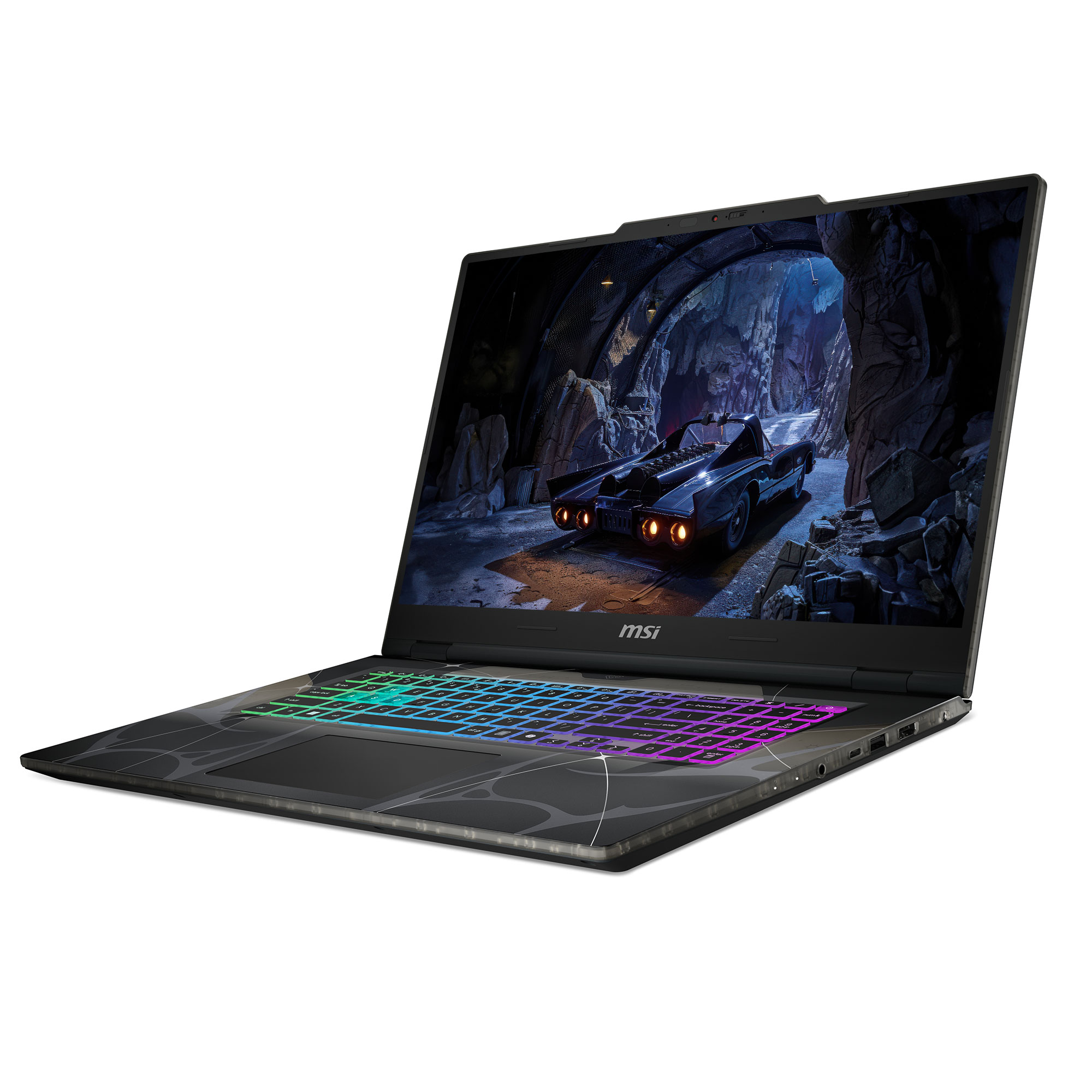 Açık bir MSI Batman temalı dizüstü bilgisayar, ekranda bir mağara ve Batmobil gösteriyor.