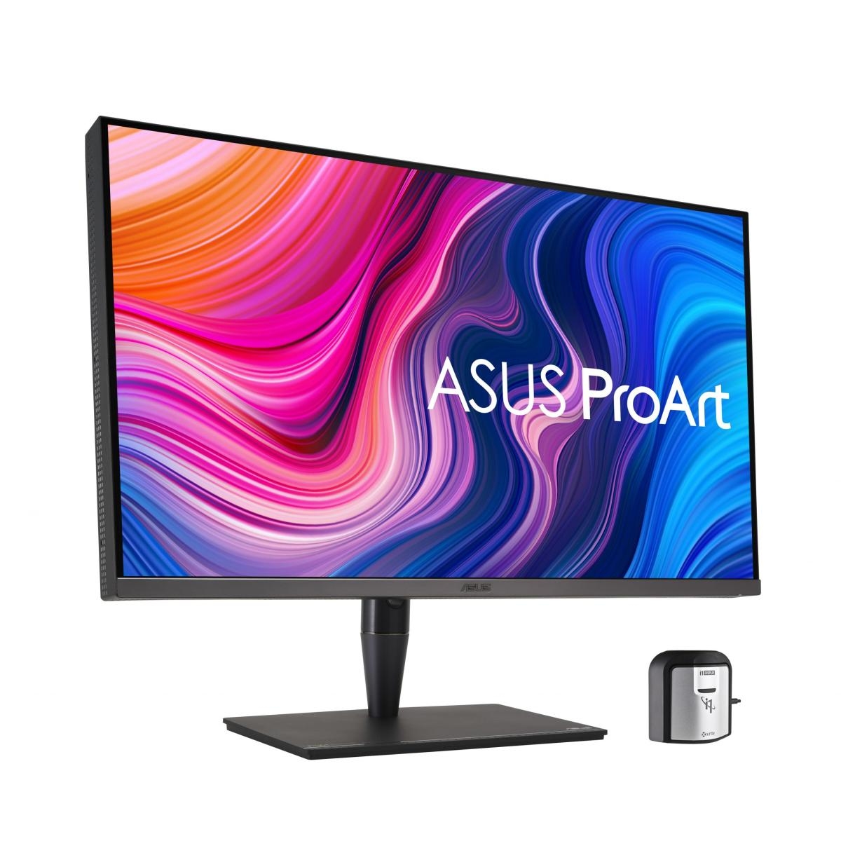 Un monitor ASUS ProArt con schermo astratto colorato e un piccolo dispositivo argentato.