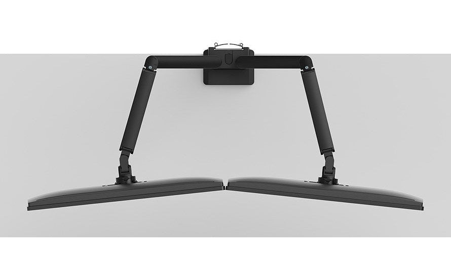 A black dual monitor arm attached to a white wall.