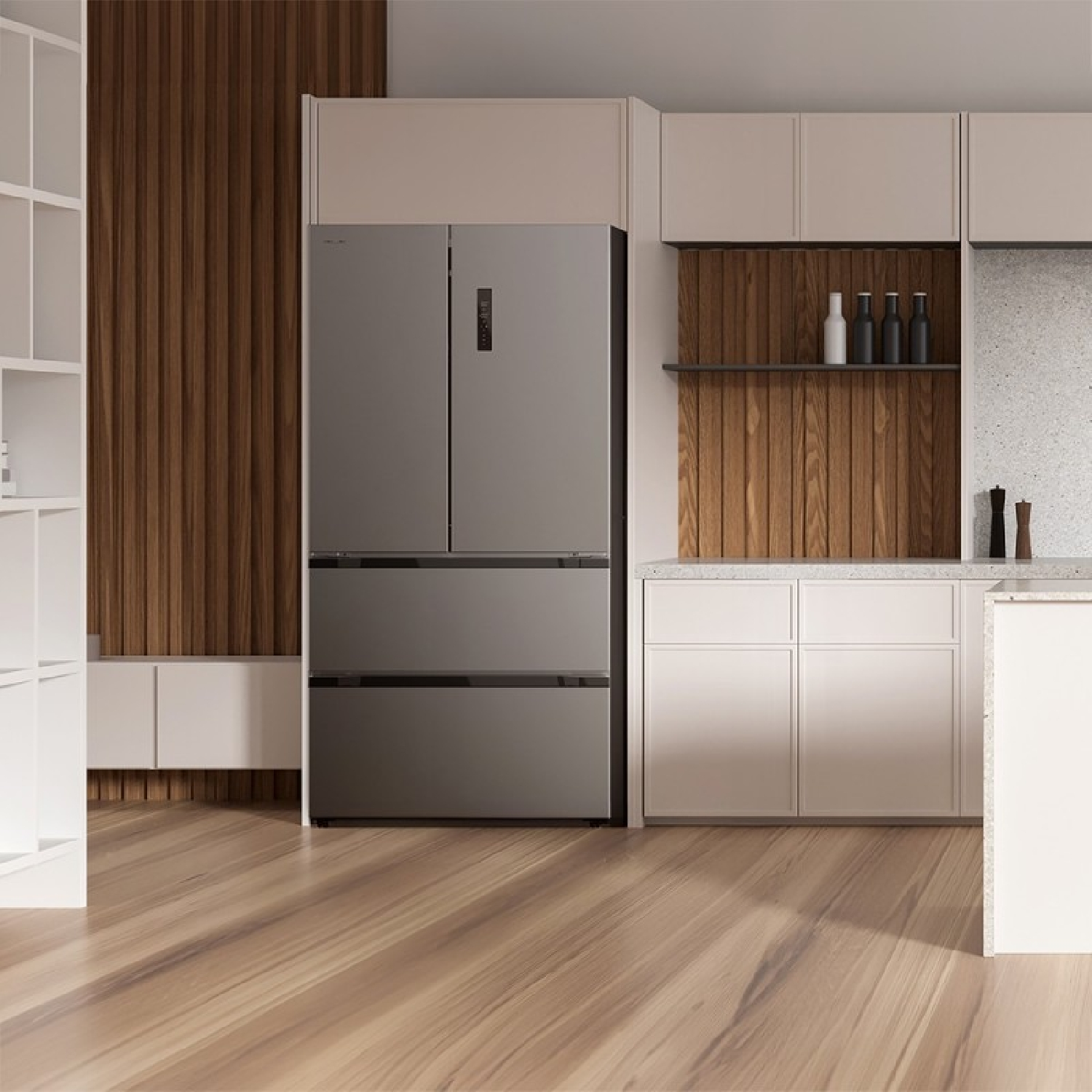 Una moderna área de cocina con refrigerador plateado, acentos de madera y gabinetes blancos.