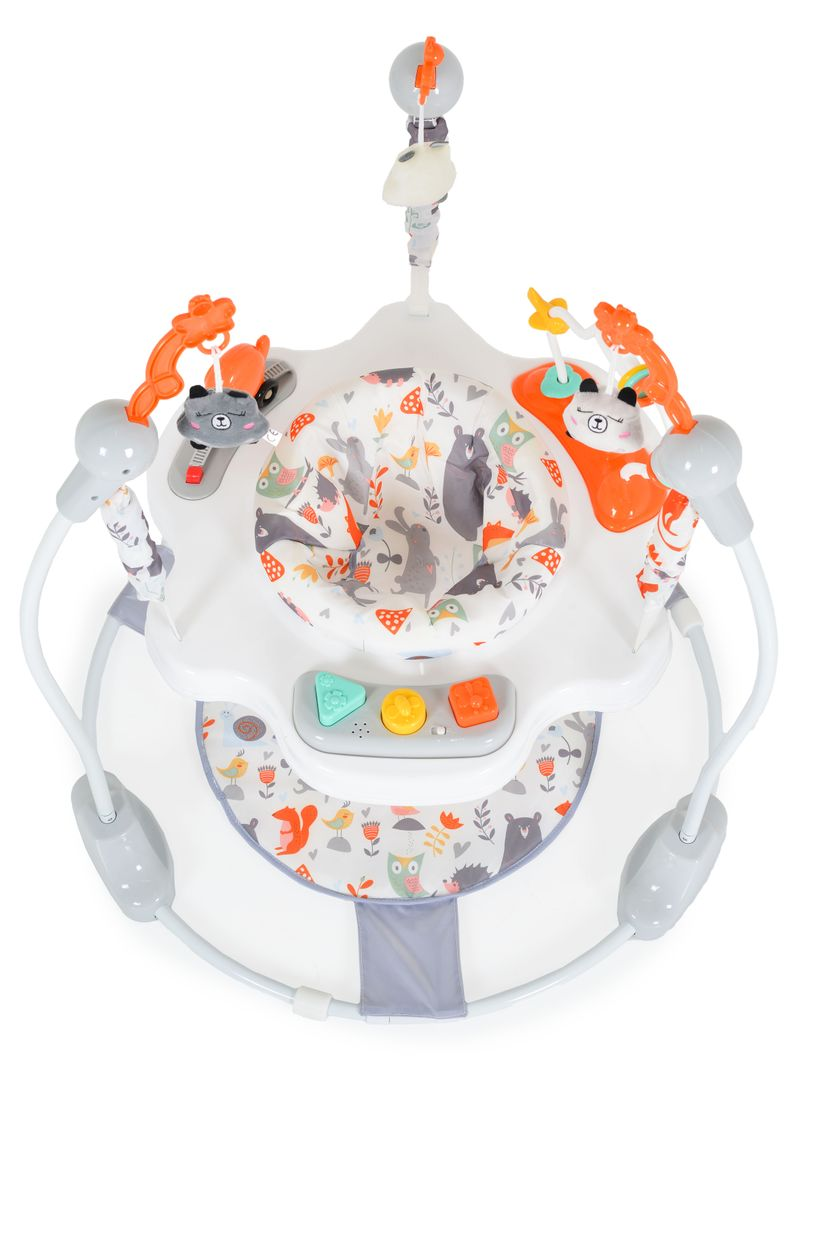 Ein weißer Baby-Jumper mit Tiermotiven und Spielzeug.