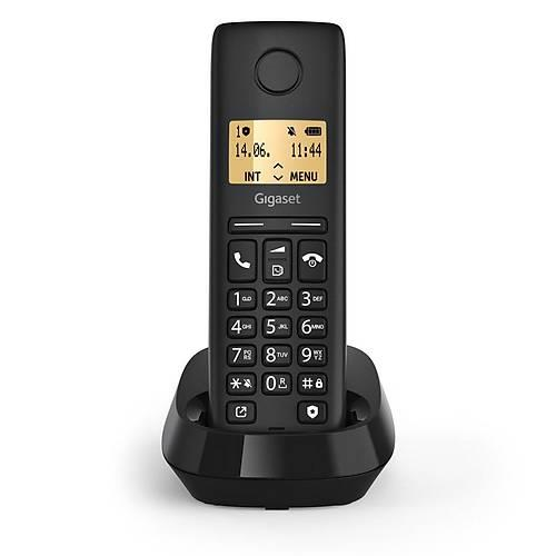 Siyah kablosuz Gigaset telefon şarj yuvasında duruyor.