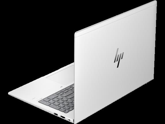 Klavye ve dokunmatik yüzeyli beyaz HP dizüstü bilgisayar, yandan ve arkadan görünüm.