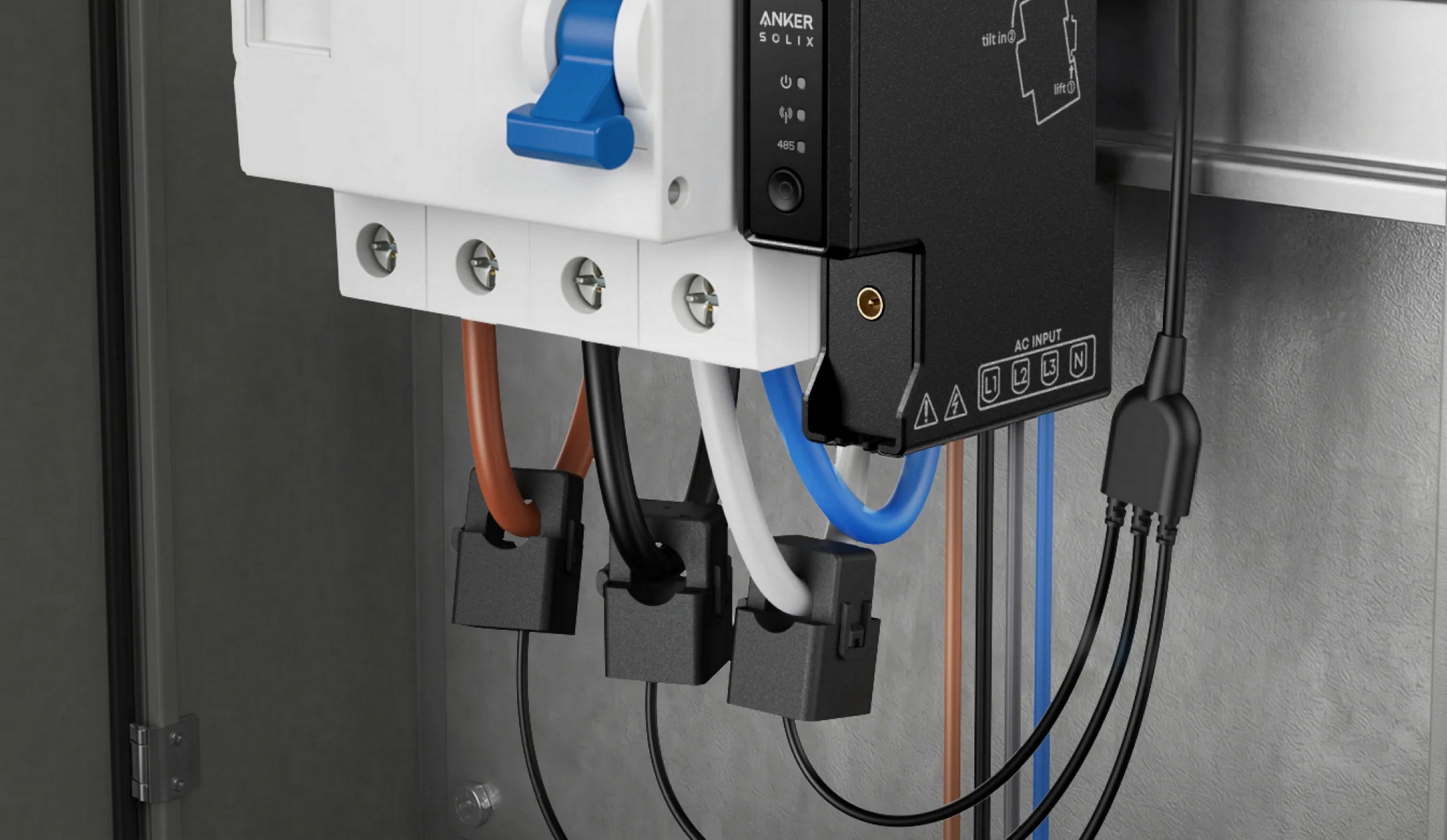 Un interruptor blanco, dispositivo negro y cables en un gabinete gris.