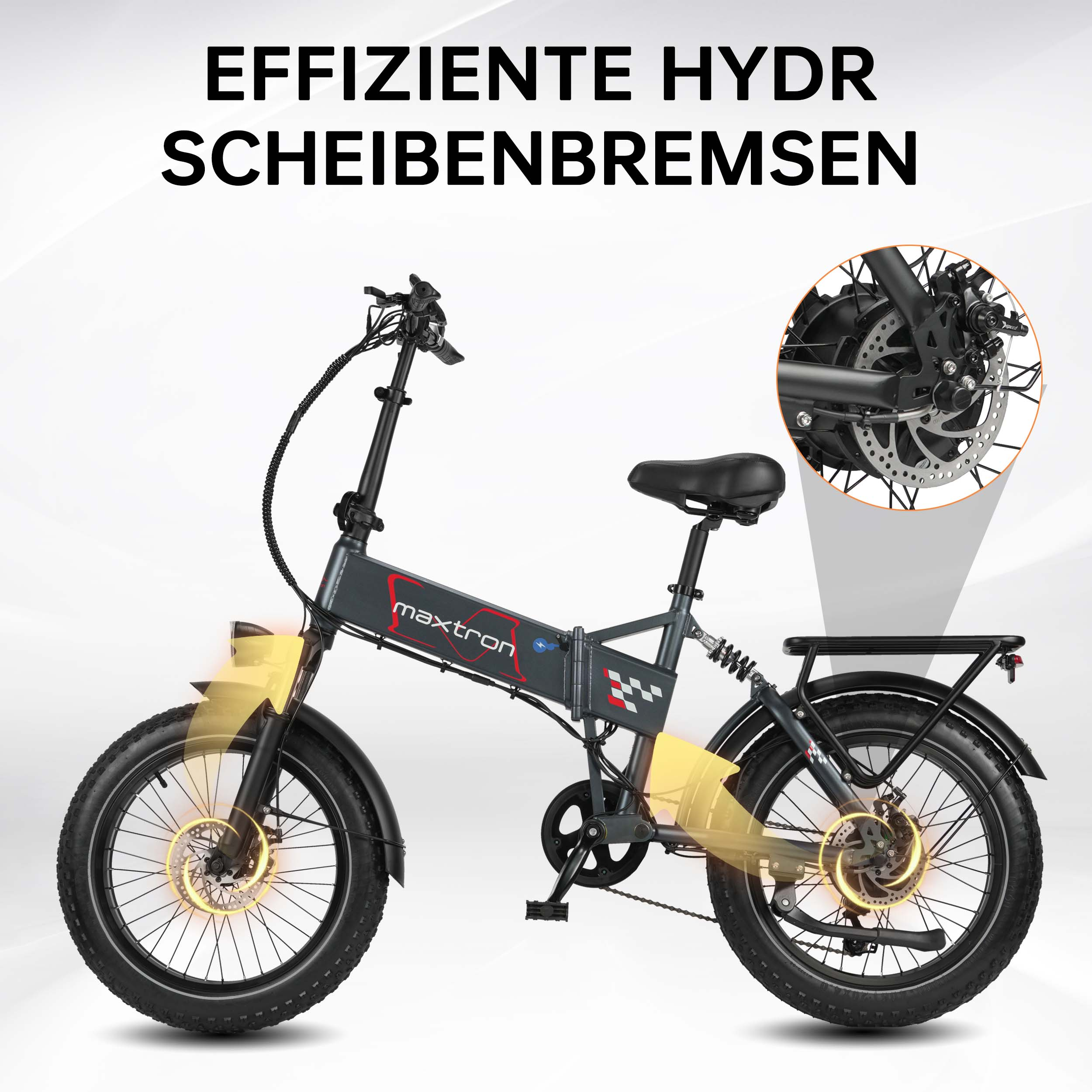 Una bicicleta eléctrica plegable gris con frenos de disco hidráulicos resaltados.