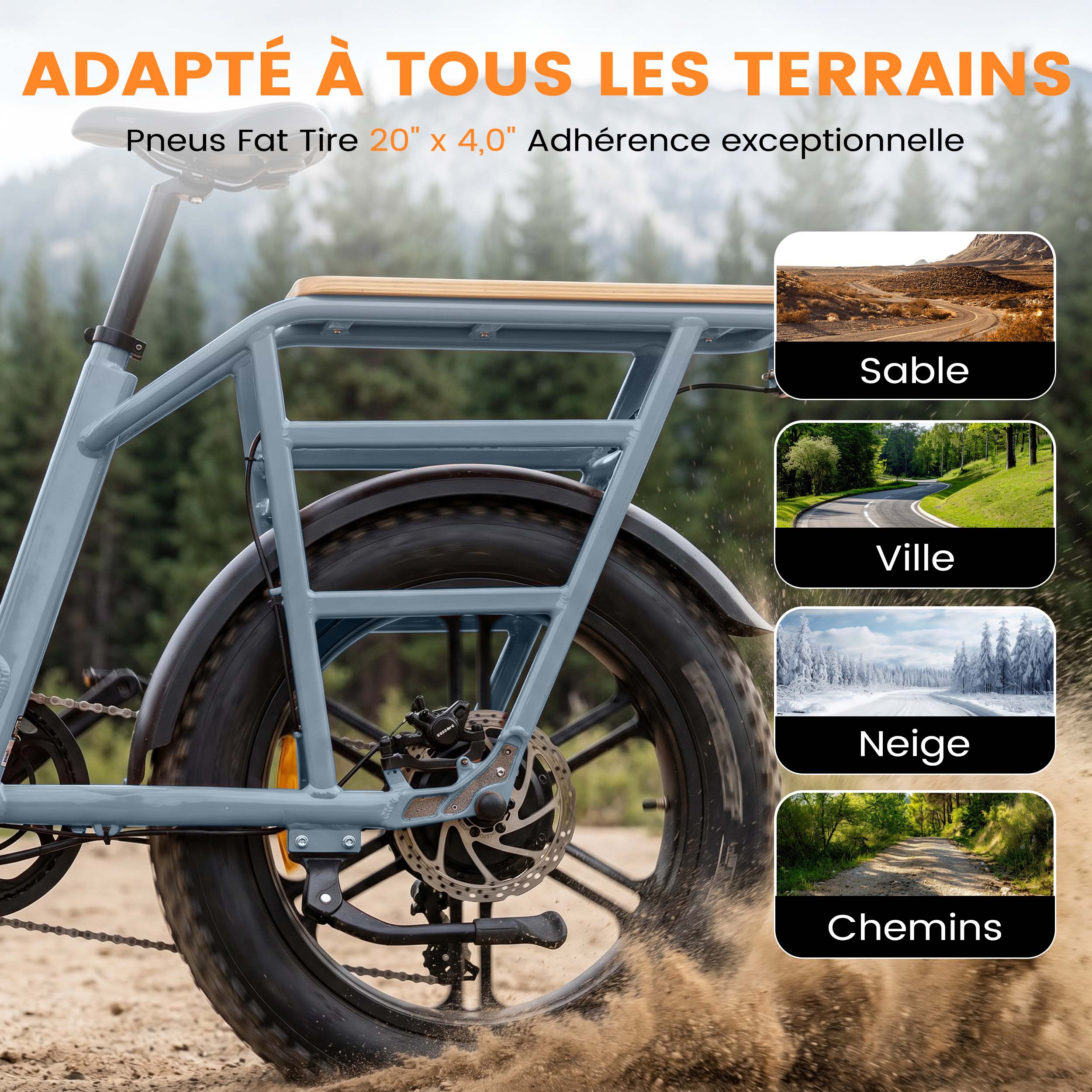 Ein graues E-Bike mit dicken Reifen fährt auf sandigem Boden.