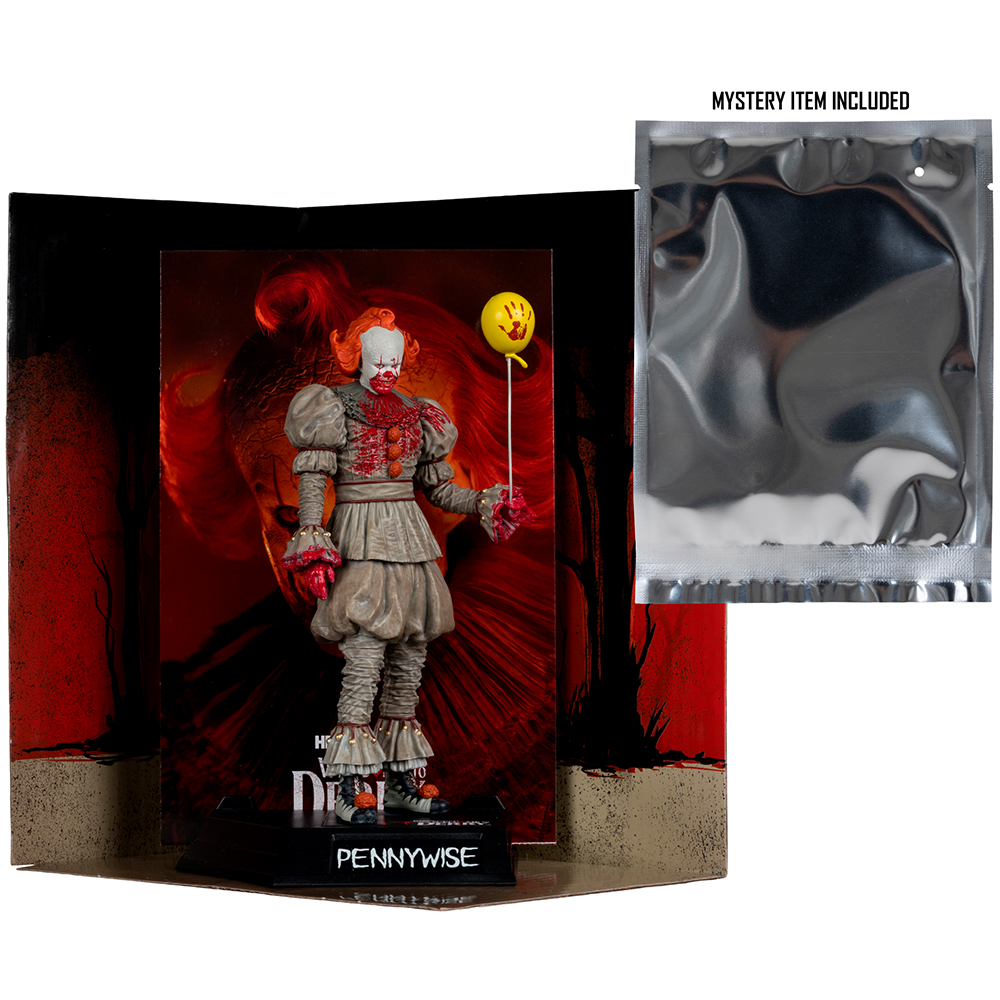 Pennywise Figur mit Ballon im Karton, neben versiegelter mysteriöser Packung.