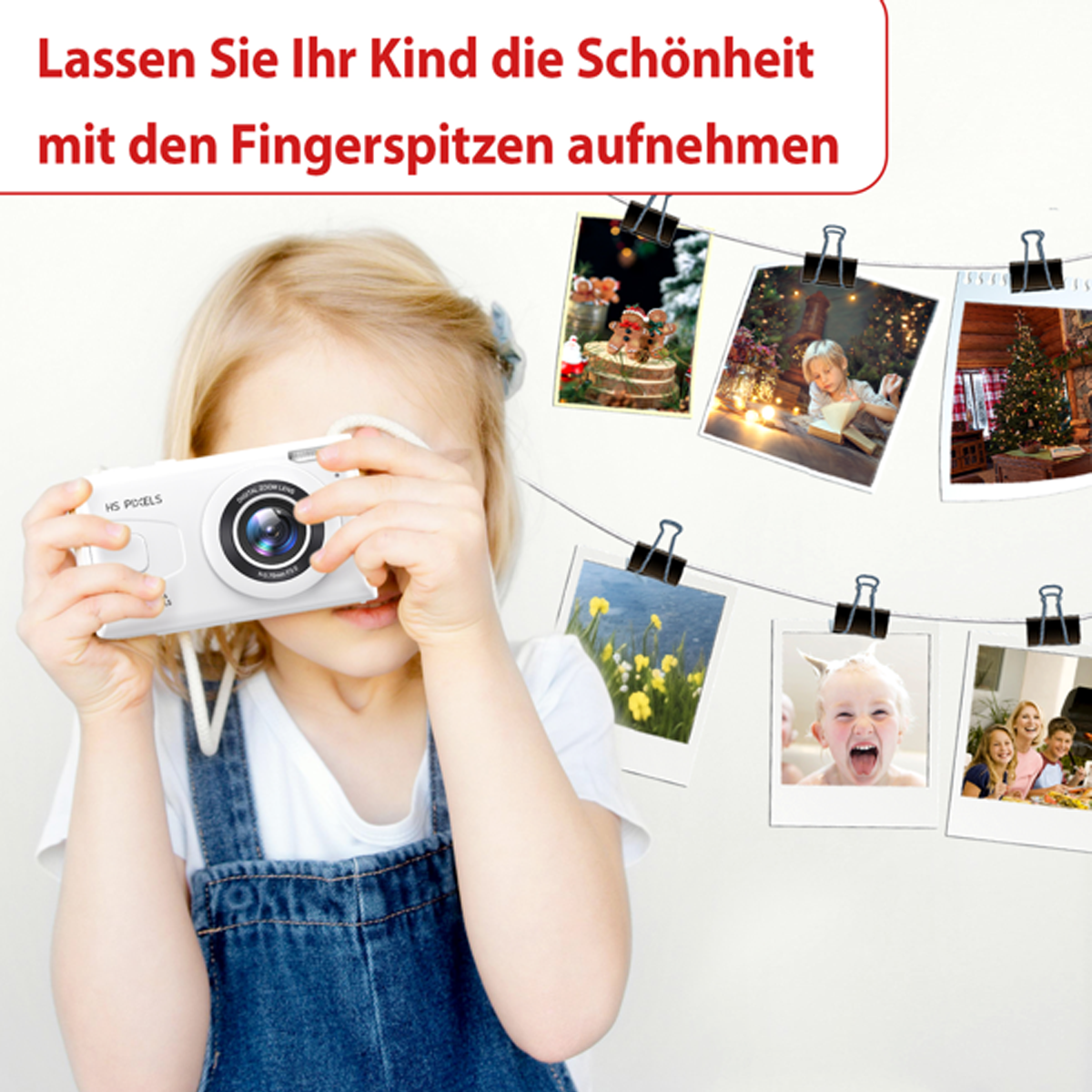 Ein kleines Kind hält eine weiße Kamera und fotografiert.