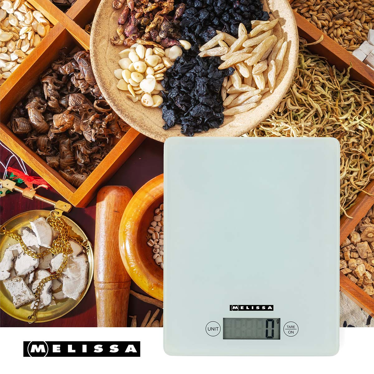 A white digital scale sits beside bowls of dried herbs and seeds.