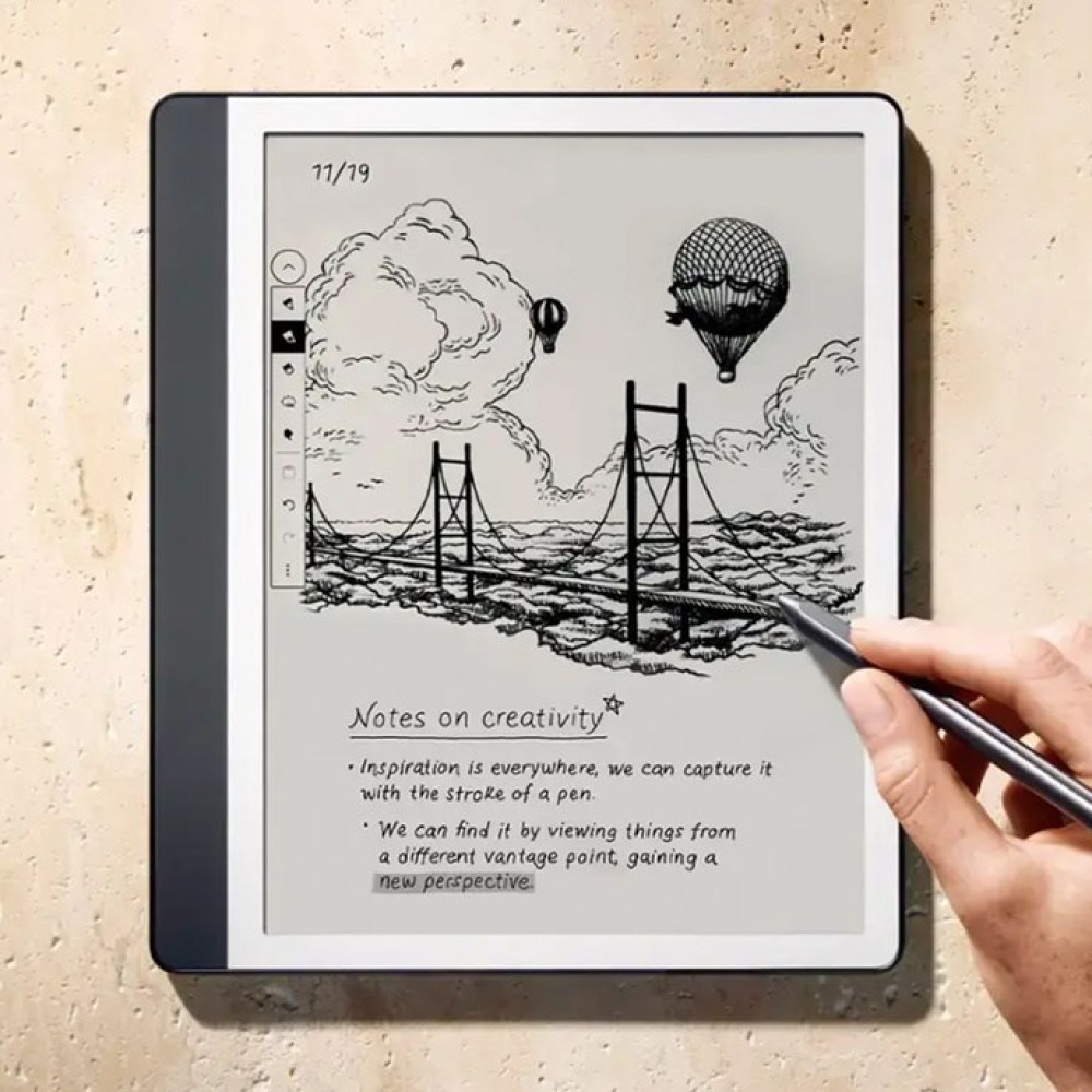 E-reader mostra un ponte, mongolfiere e appunti sulla creatività.