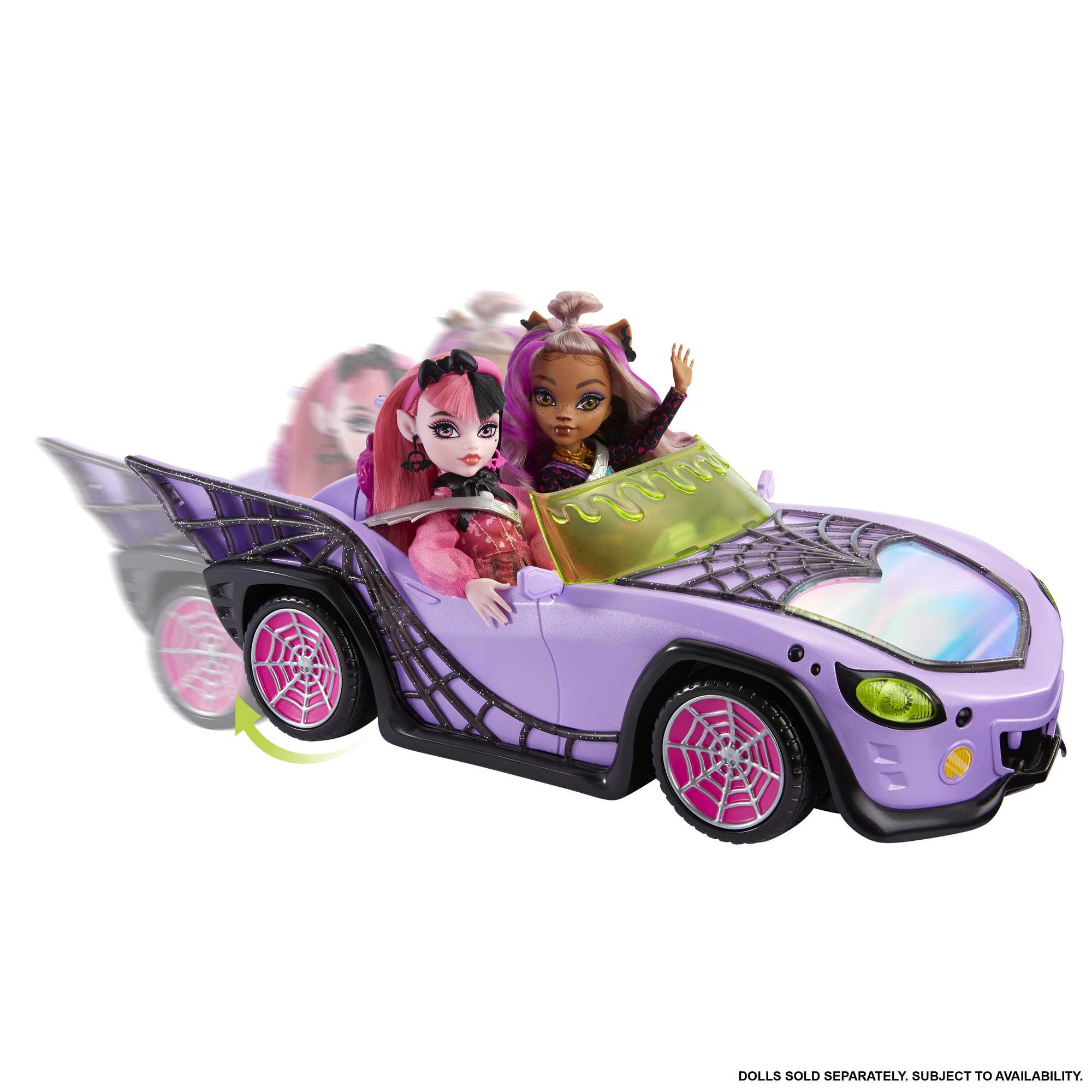 Zwei Puppen in einem lila Auto mit Spinnennetzmuster und pinken Felgen.
