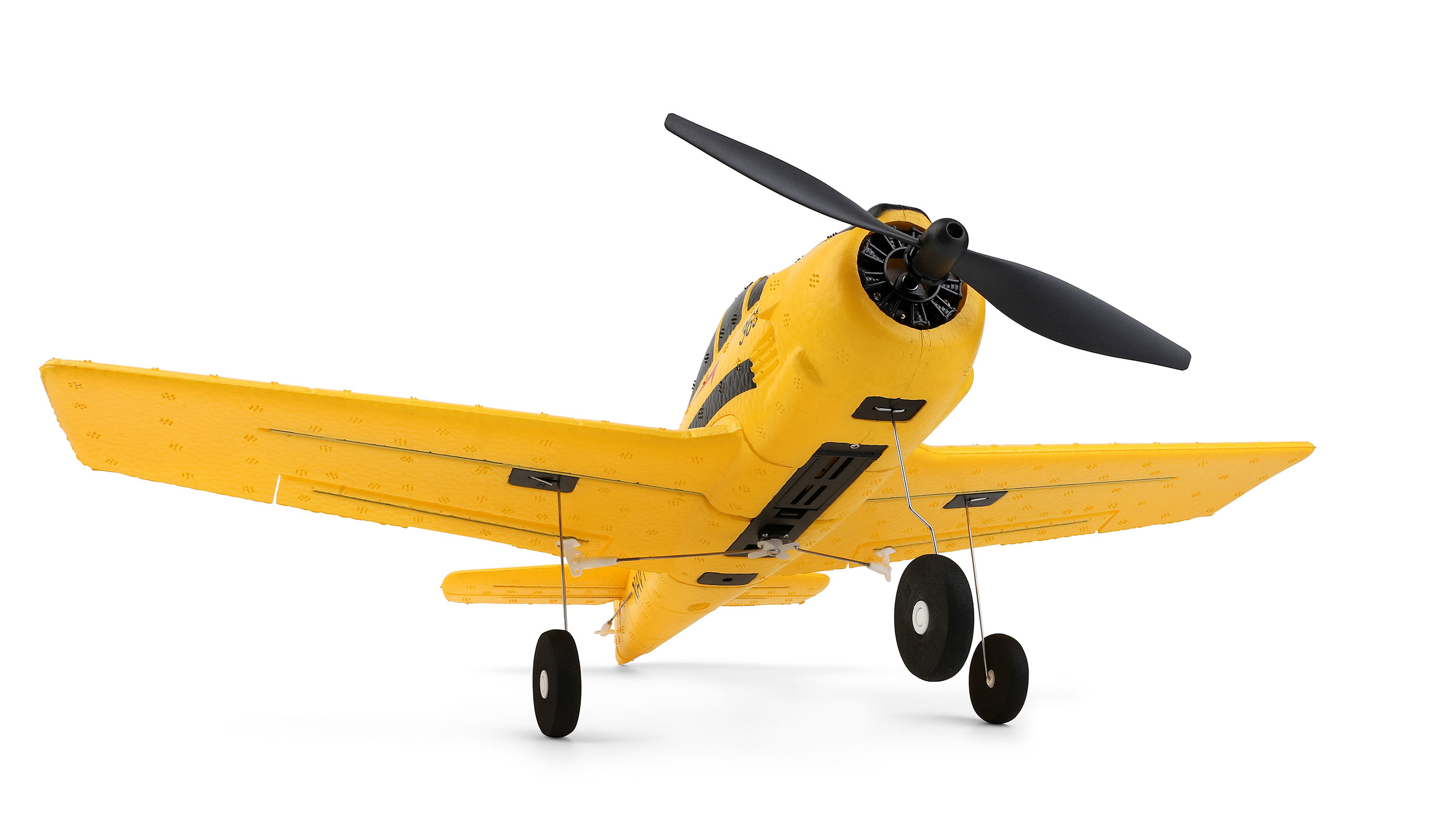 Un avión modelo amarillo con rayas negras y hélice sobre fondo blanco.